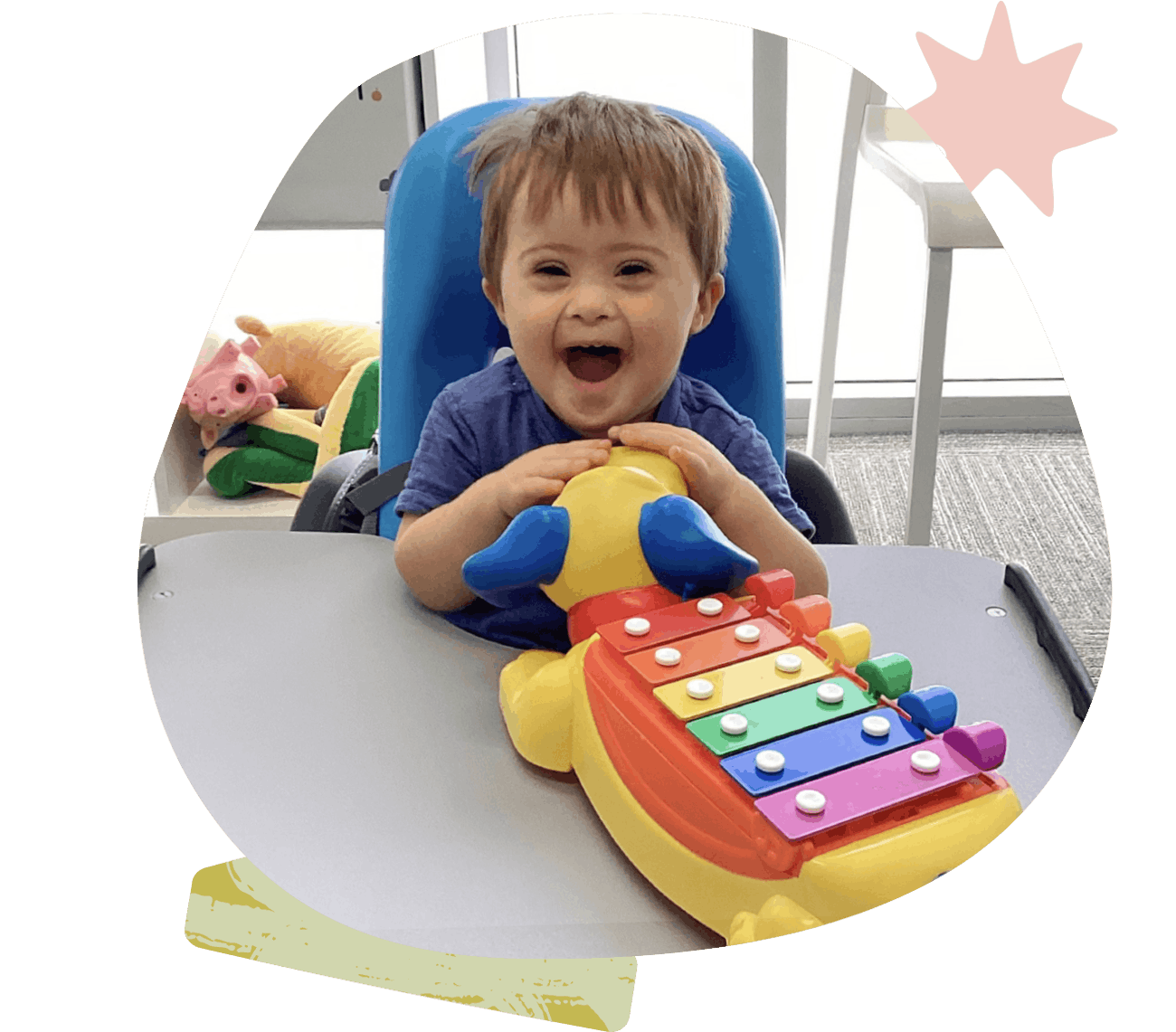 Small child smiling during a therapy session