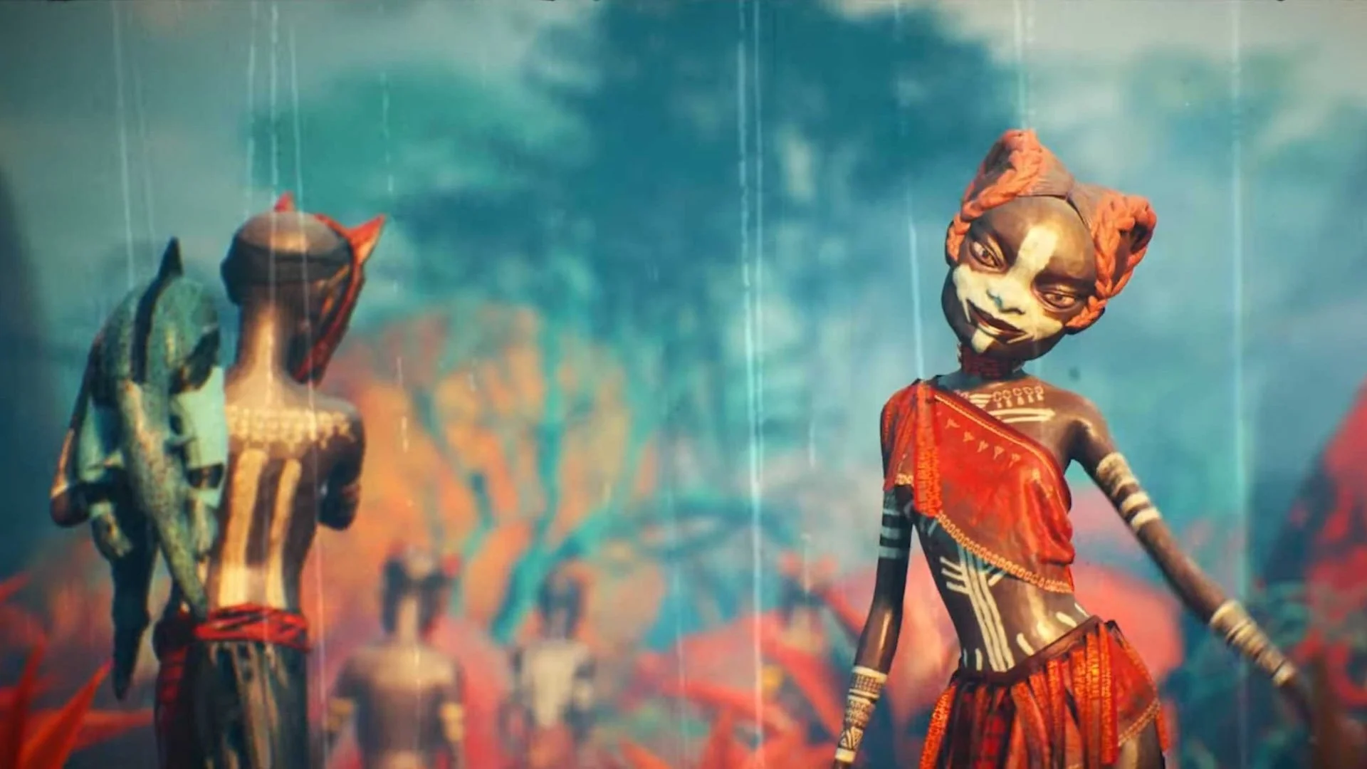 Colorful carved wooden figures of women with intricate painted designs, dressed in vibrant clothing, set against a blue background.