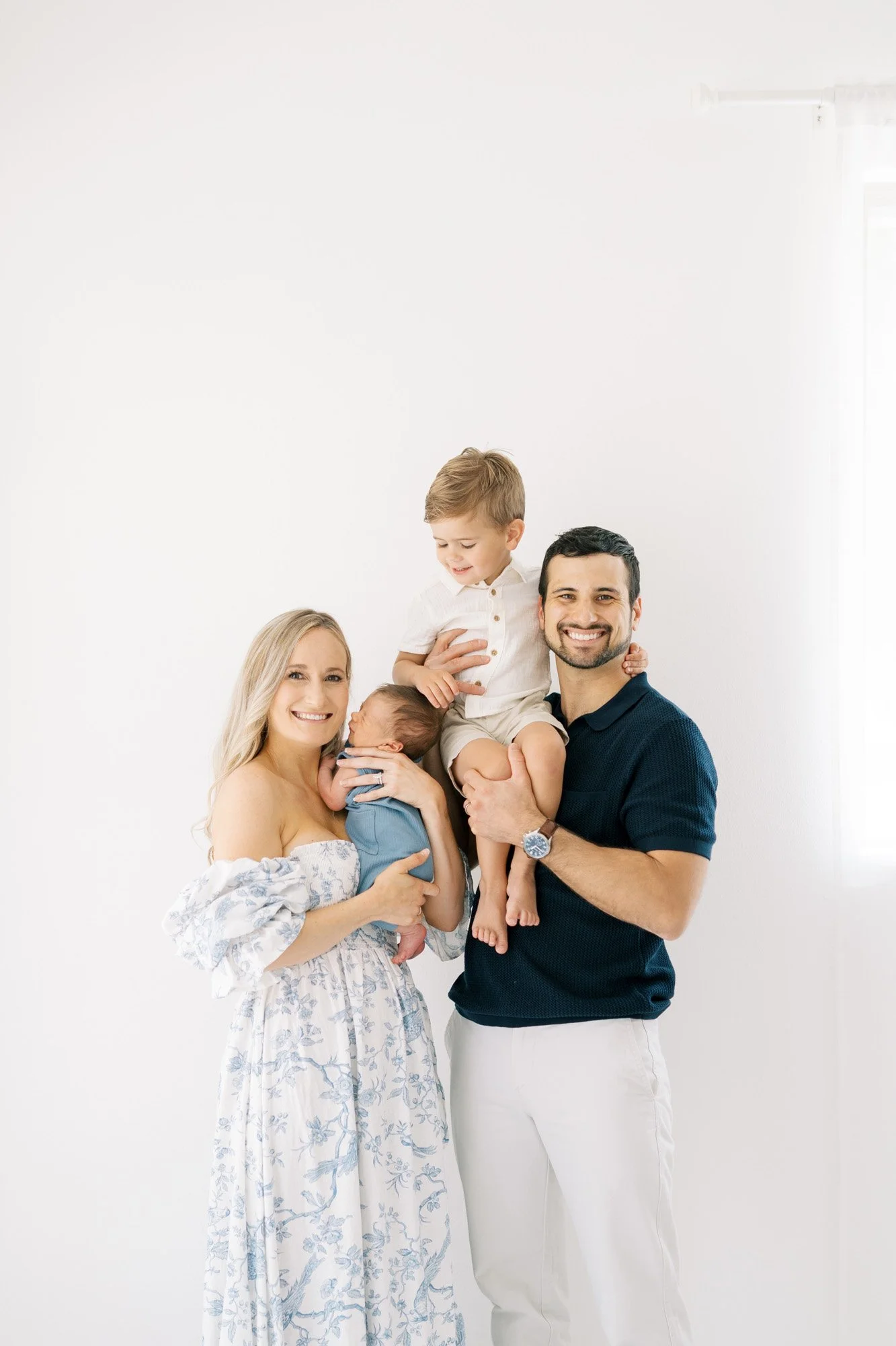 Family smiling in studio