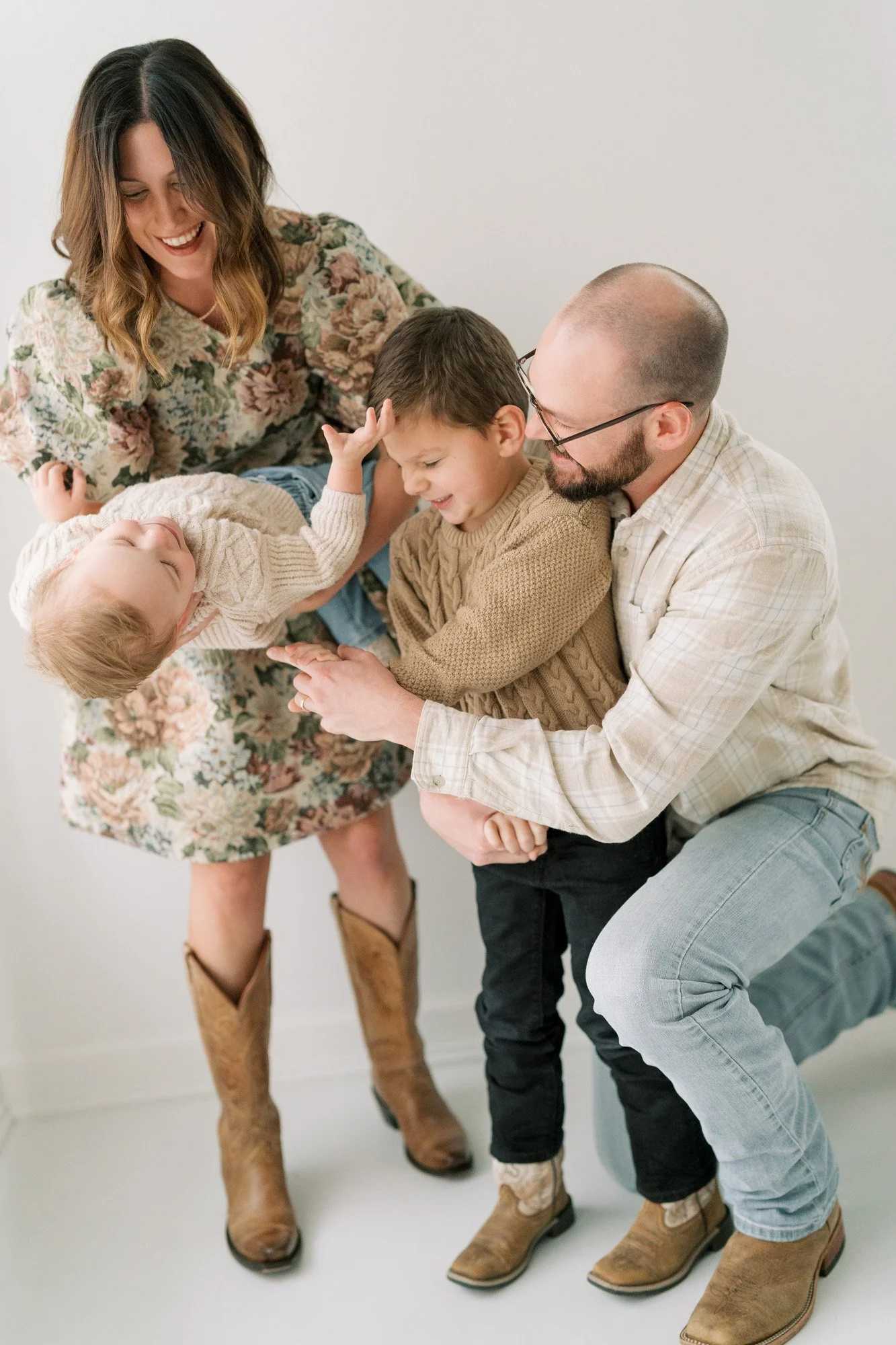 Tristan and her husband in the studio with their two boys playing