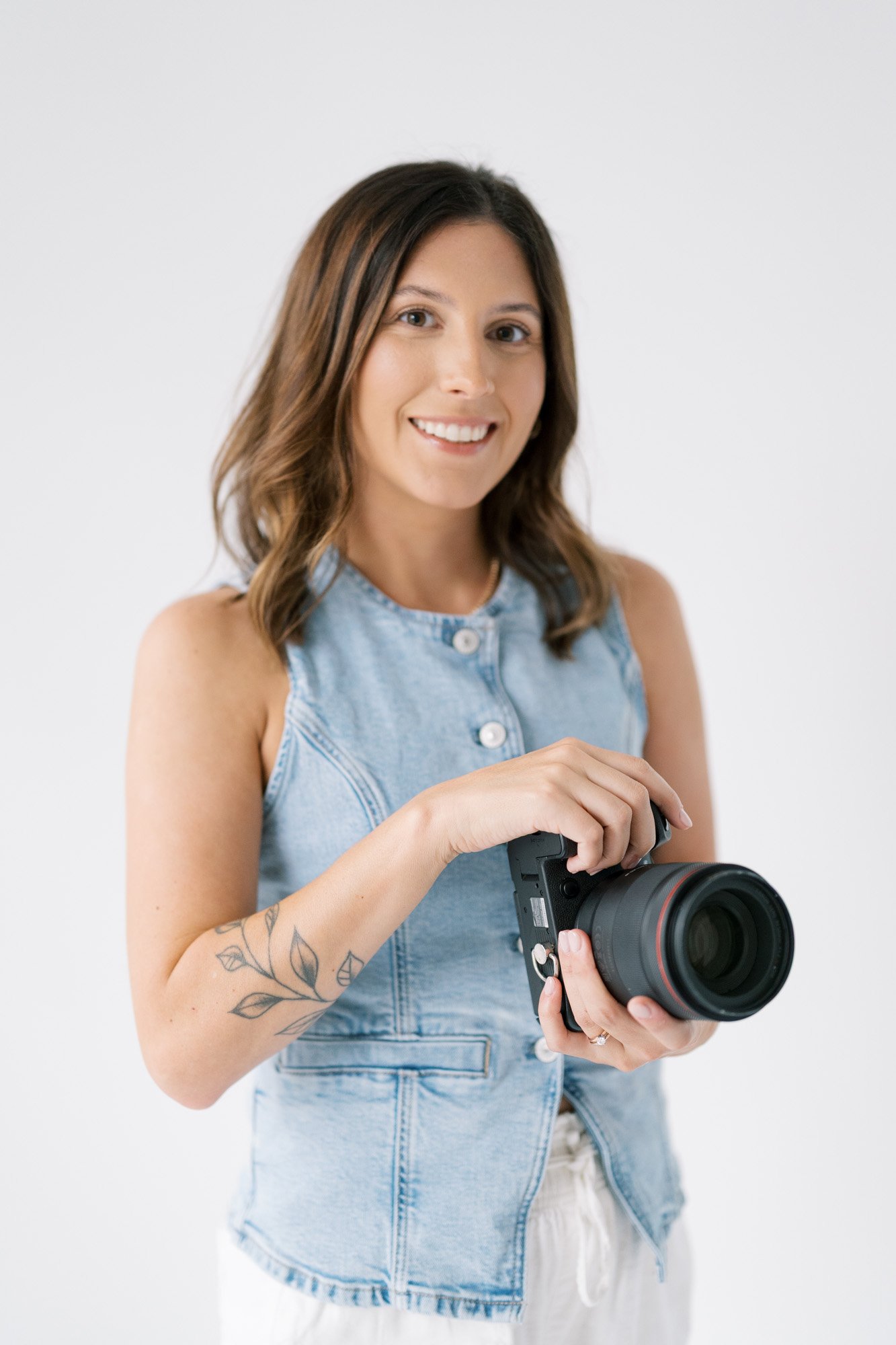 tristan smiling holding camera