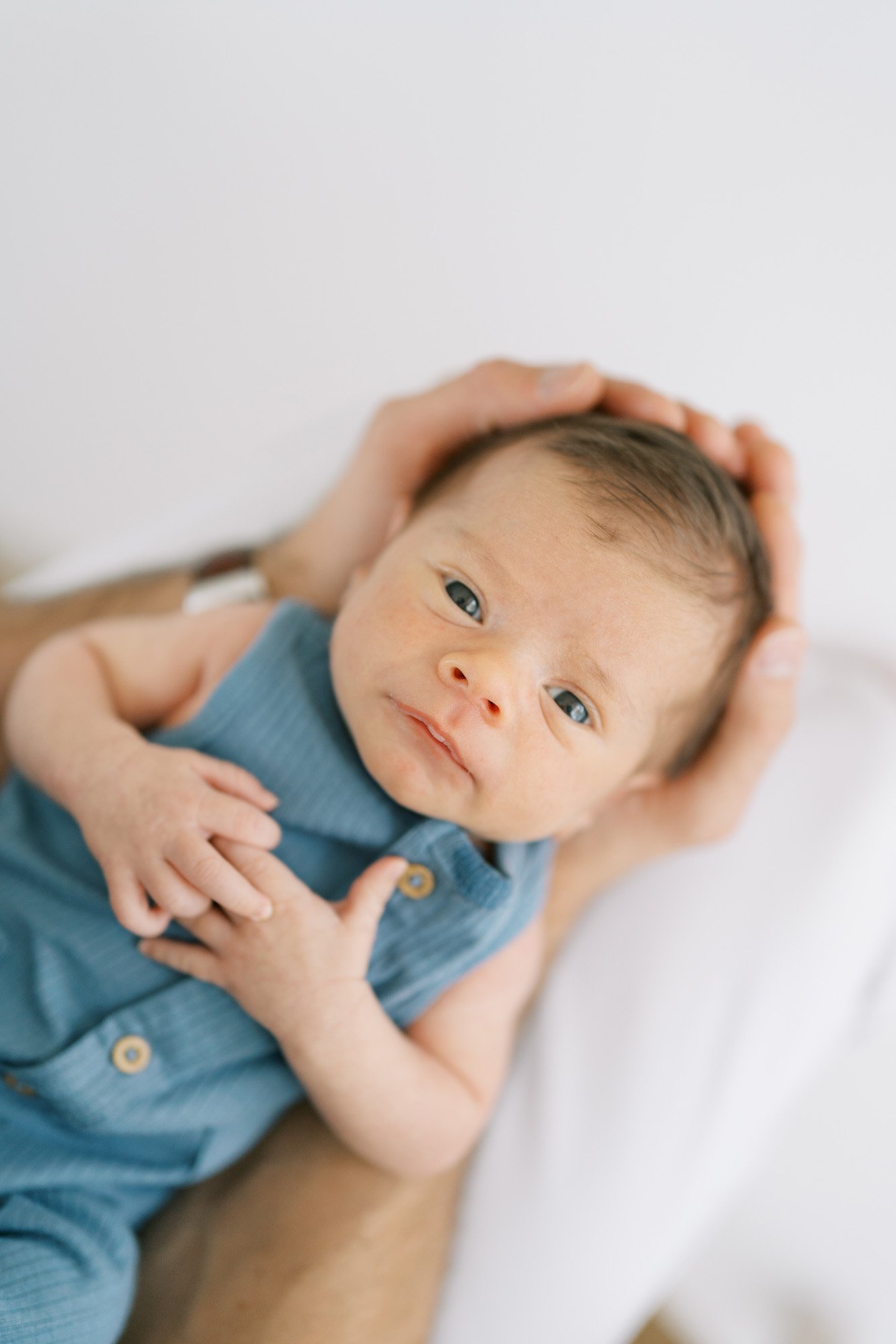 Newborn looking at camera with big eyes