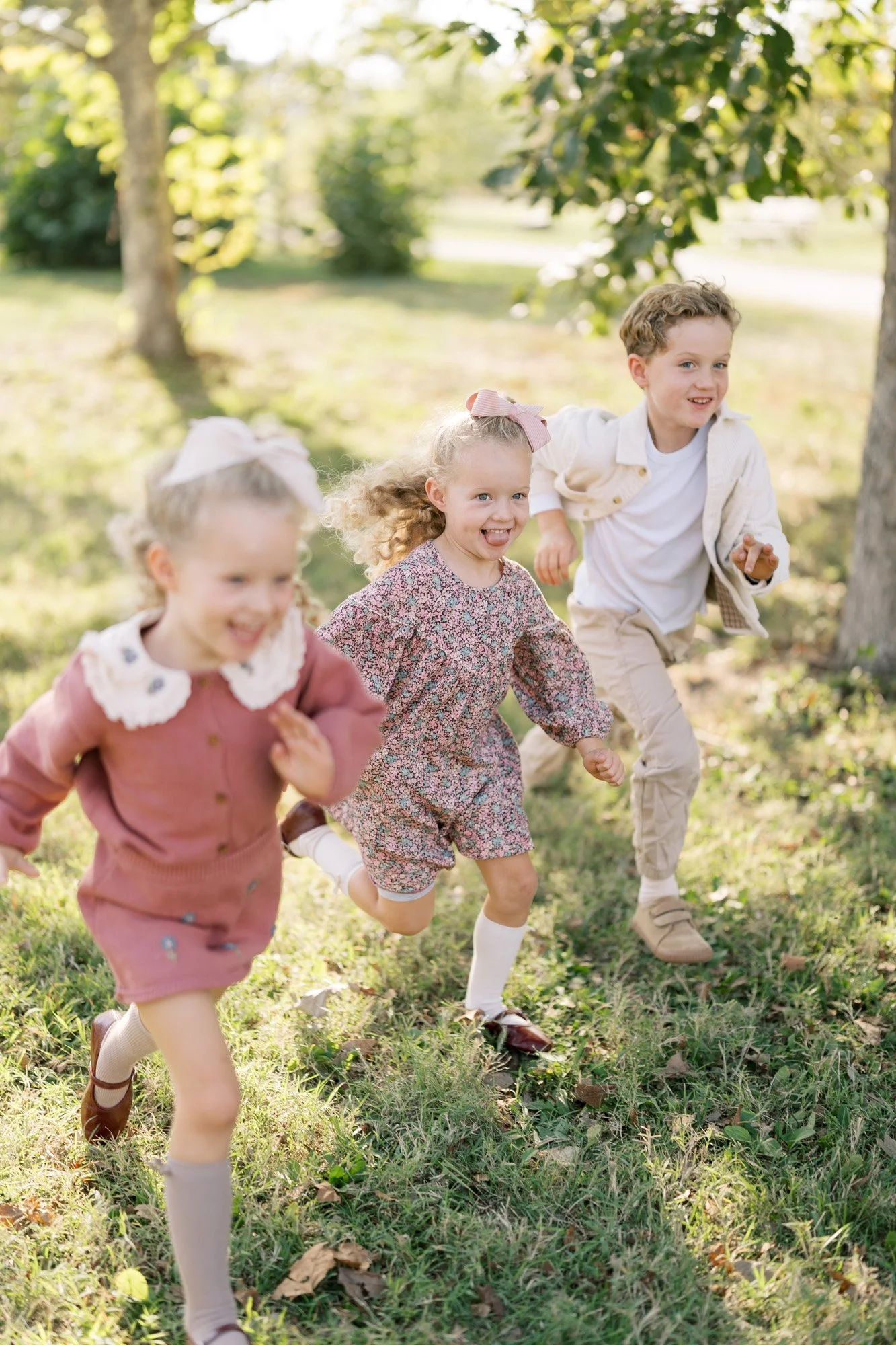 Kids running in a diagonal line during photo shoot outdoors
