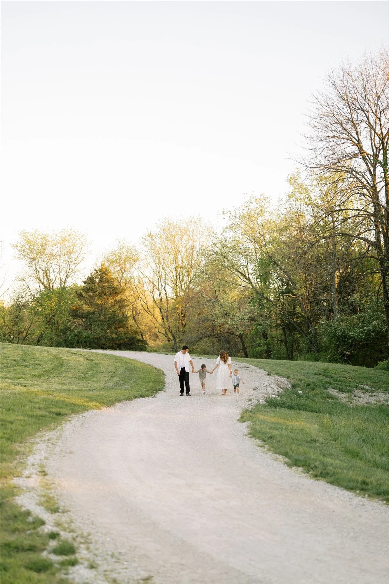 Family walking down path in Queeny Park