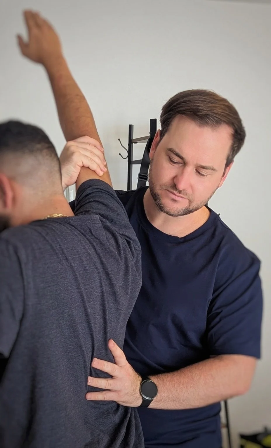 Specialist neurological physiotherapist providing hands-on gait training and movement support for a stroke survivor in their home in Goulburn.
