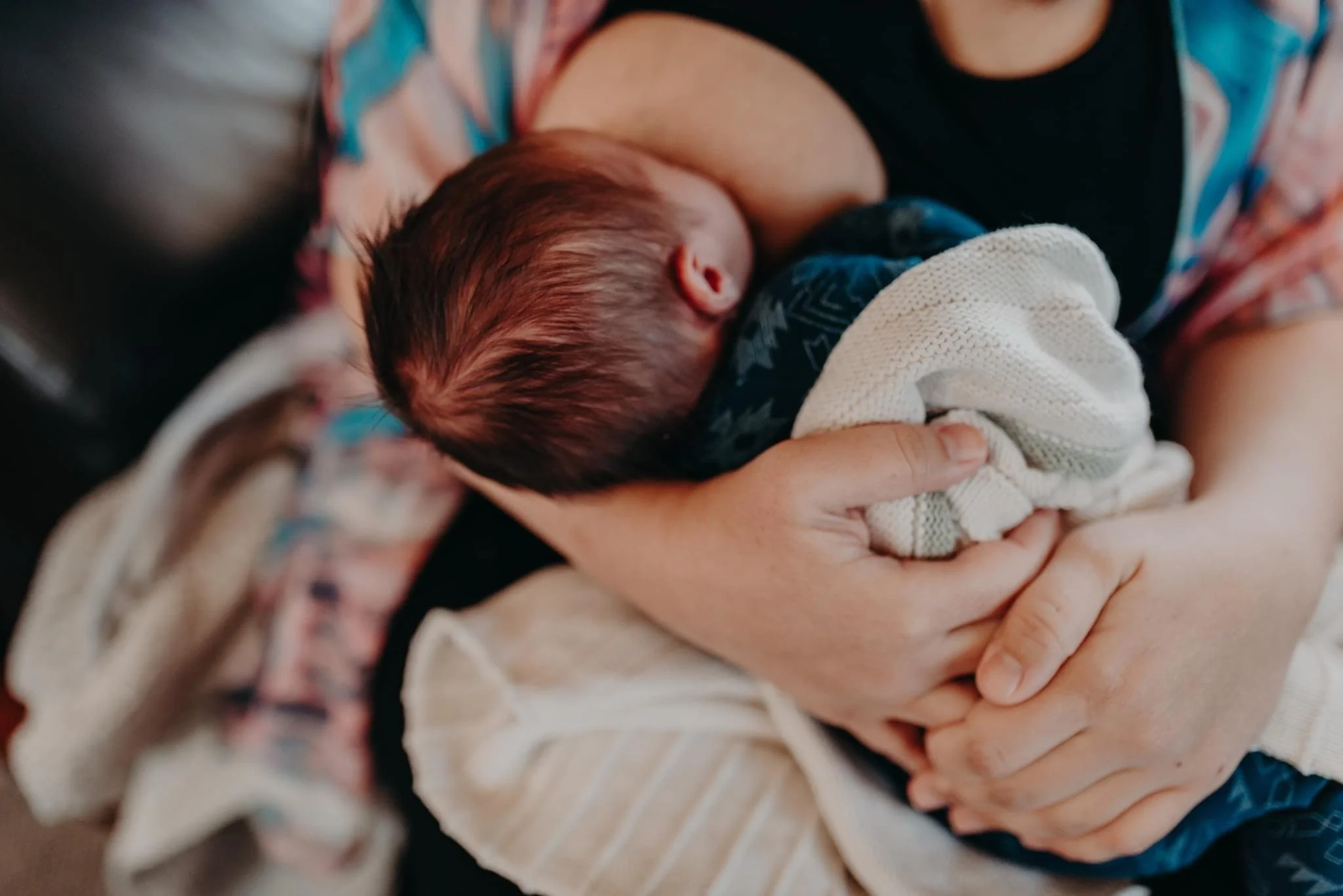 woman breastfeeding baby