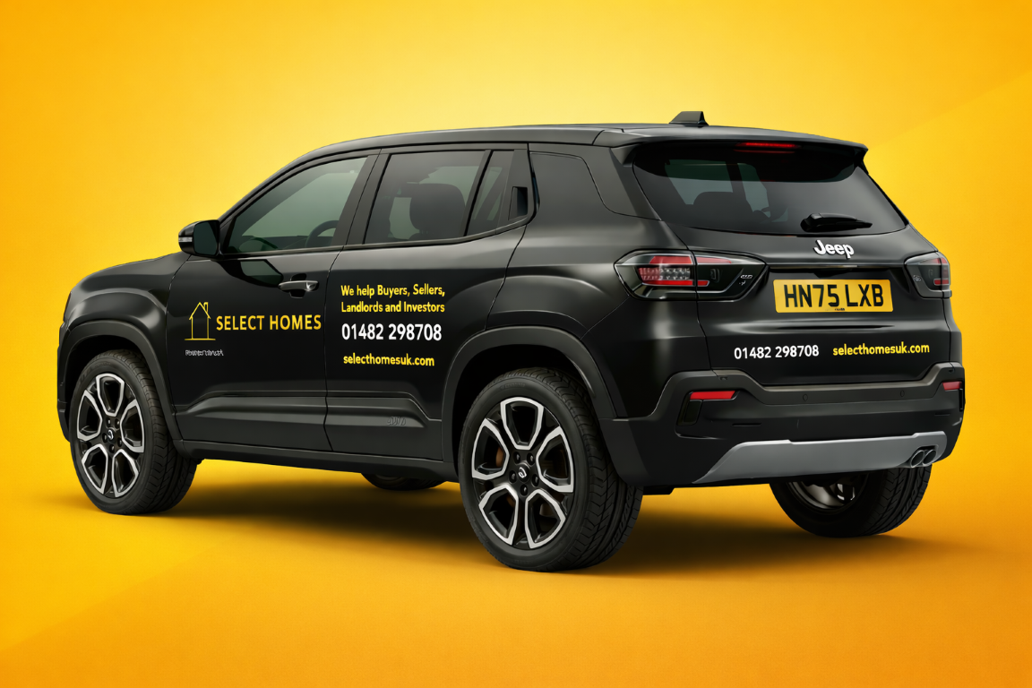 Black Jeep SUV with yellow advertisement for Select Homes, a real estate company, on the side and back, set against a yellow background.