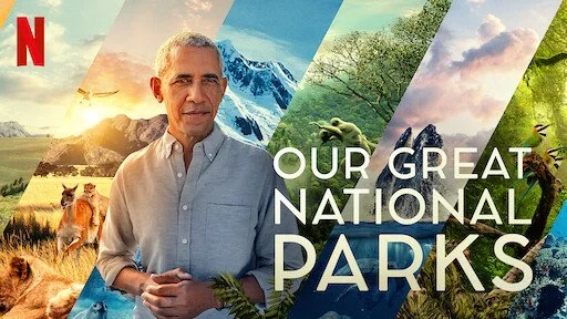 Close-up of a man in a light blue shirt standing in front of a collage of natural landscapes including mountains, forests, and waterfalls, with the text "Our Great National Parks" and the Netflix logo.