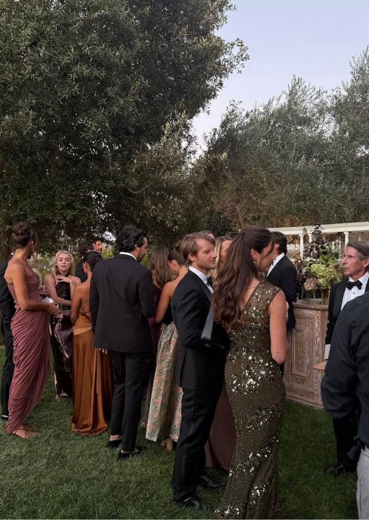 Wedding guests gathered outdoors