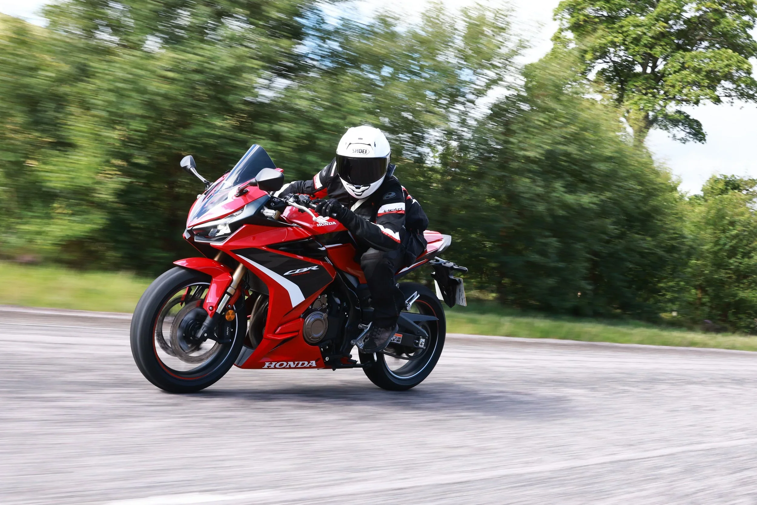 Girl riding CBR500R on road