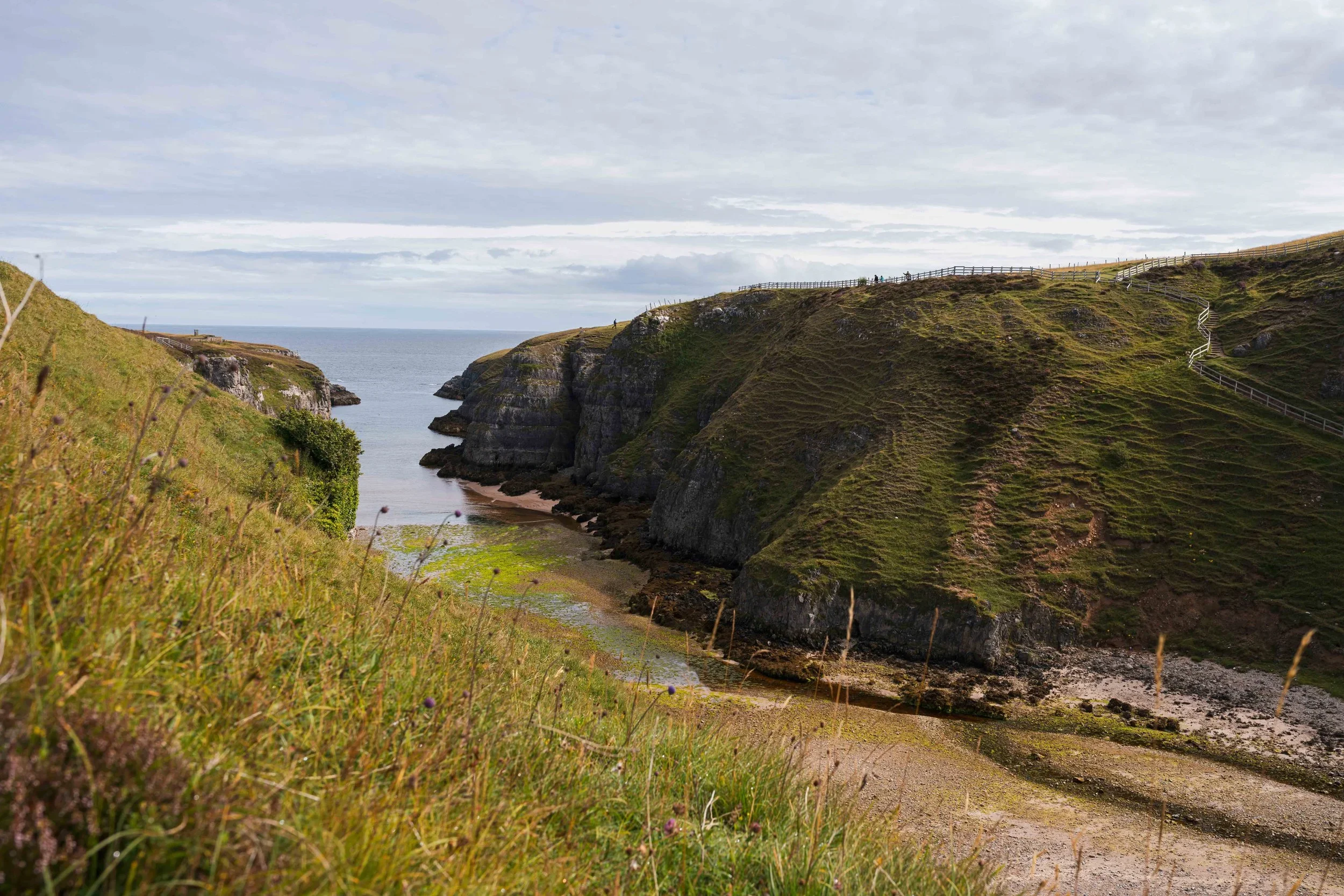 Smoo cave in scotland, see, clifs, people in the distance