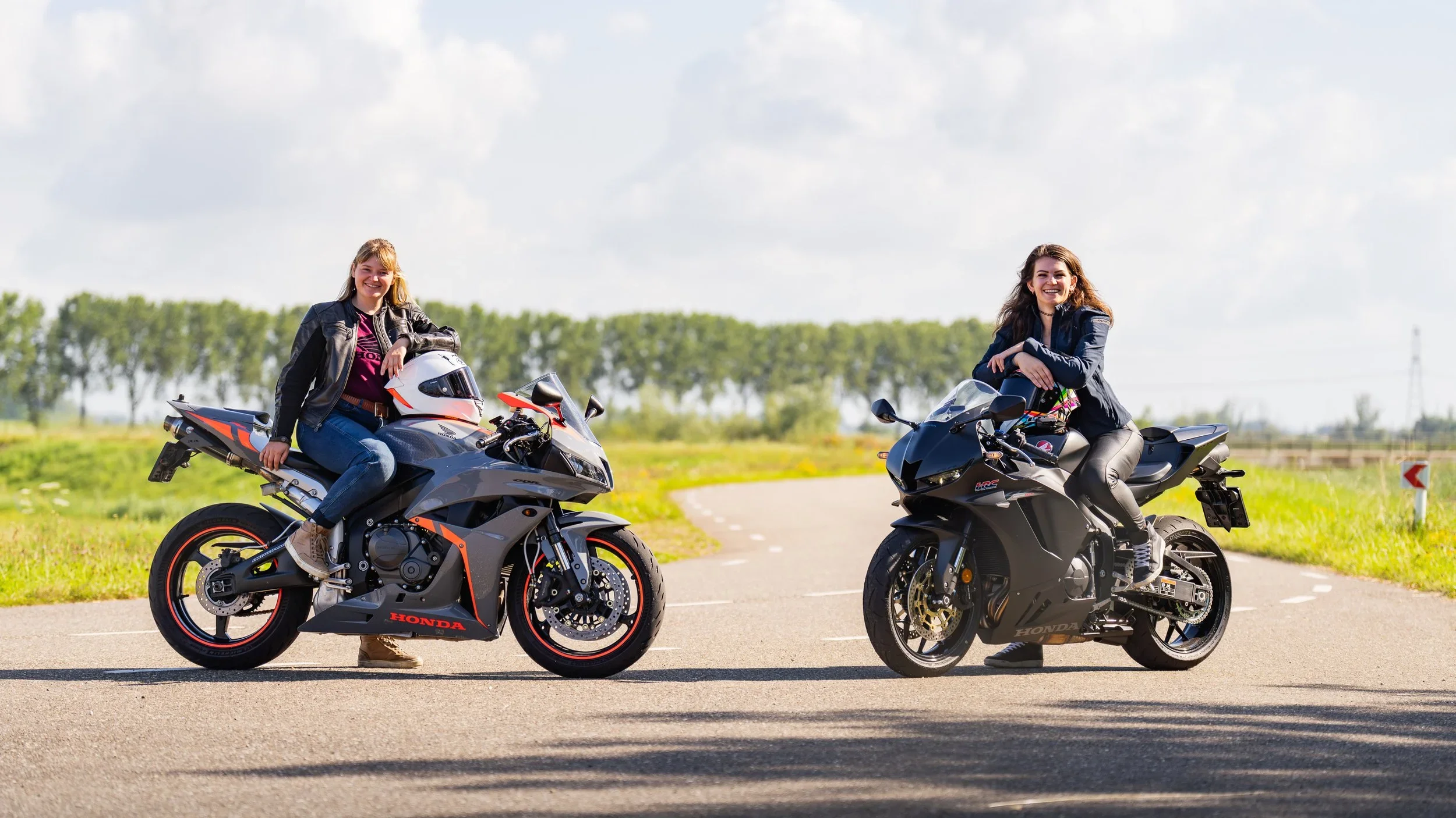 Girls sitting on race bikes