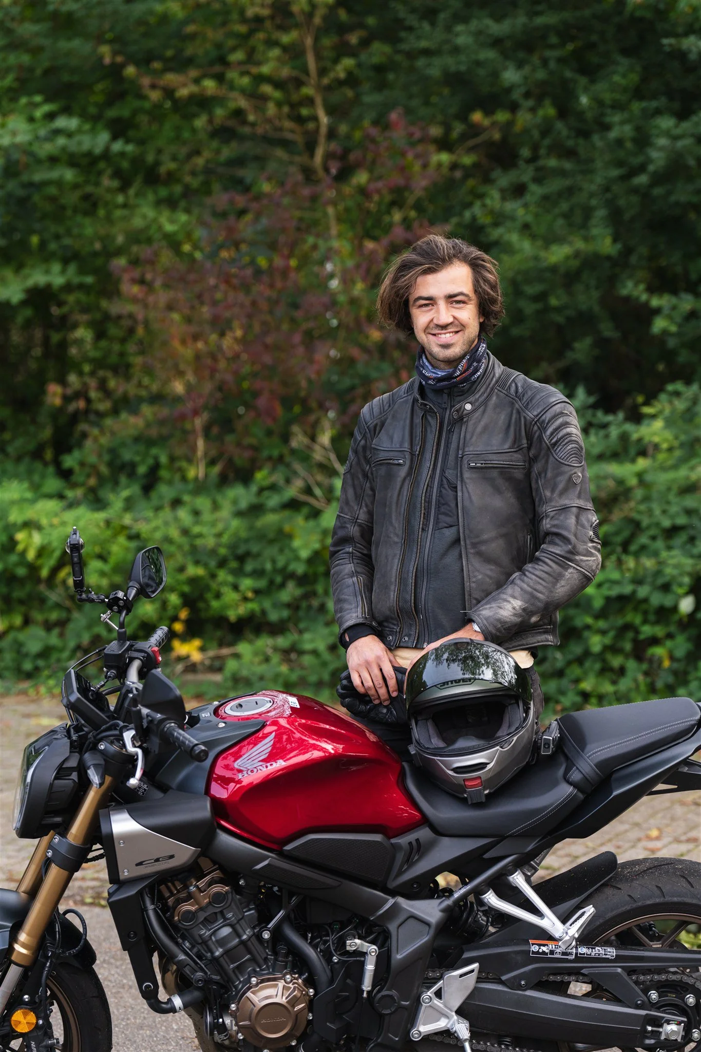 Person standing next to Honda CB650R