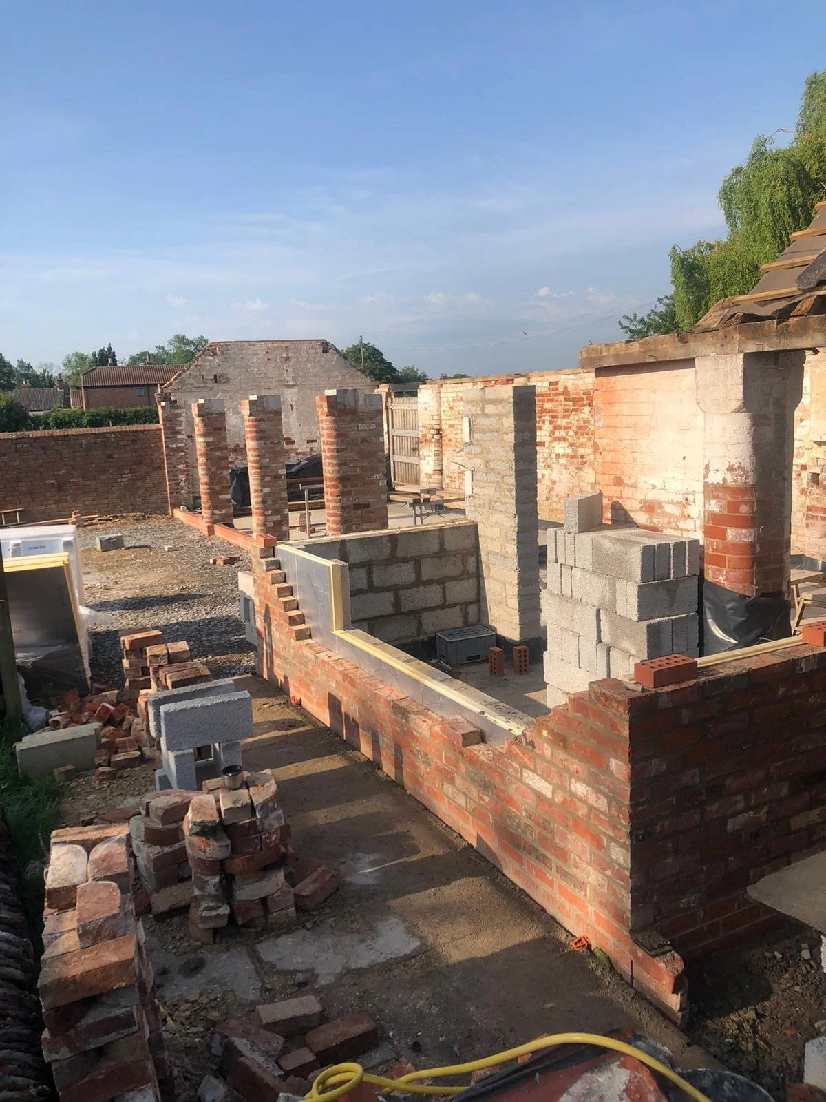 Structural masonry and brickwork installation during an ongoing barn conversion project near Grantham.