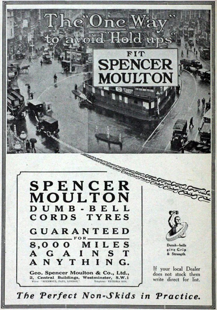 Vintage black and white advertisement for Spencer Moulton, a company selling dumb-bell cords and tires. The ad features a city street scene with cars, pedestrians, and a subway station, with text highlighting the benefits of Spencer Moulton products, including guarantees for 8,000 miles and a slogan about non-skids.