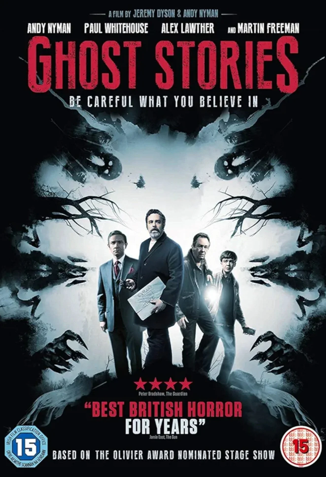 Poster for the horror film 'Ghost Stories' featuring four men standing in front of a spooky, supernatural background with ghostly faces, hands, and branches. The poster includes quotes and ratings, highlighting it as a British horror film.