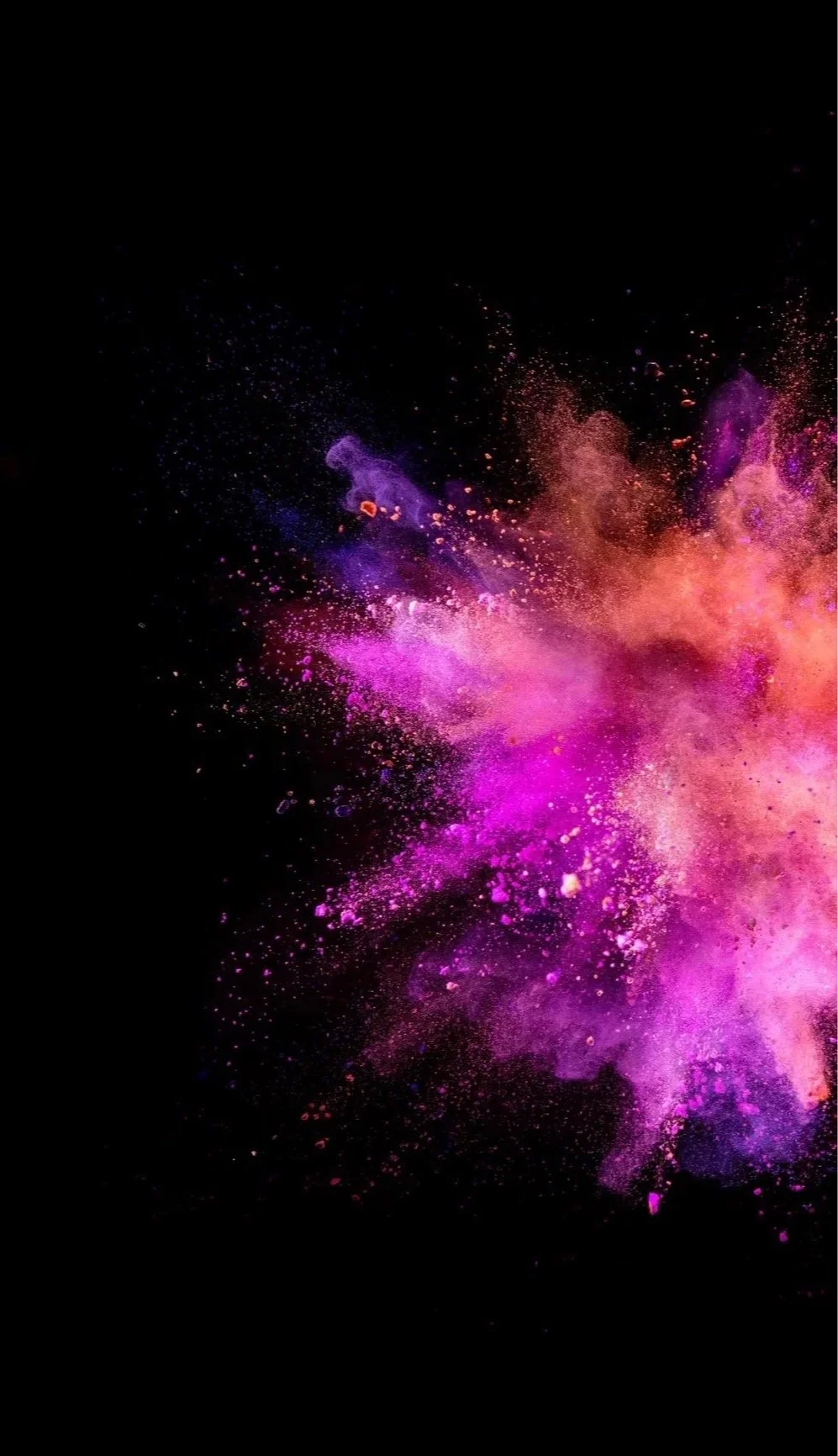 Colorful powder explosion in shades of pink, purple, and orange against a black background.