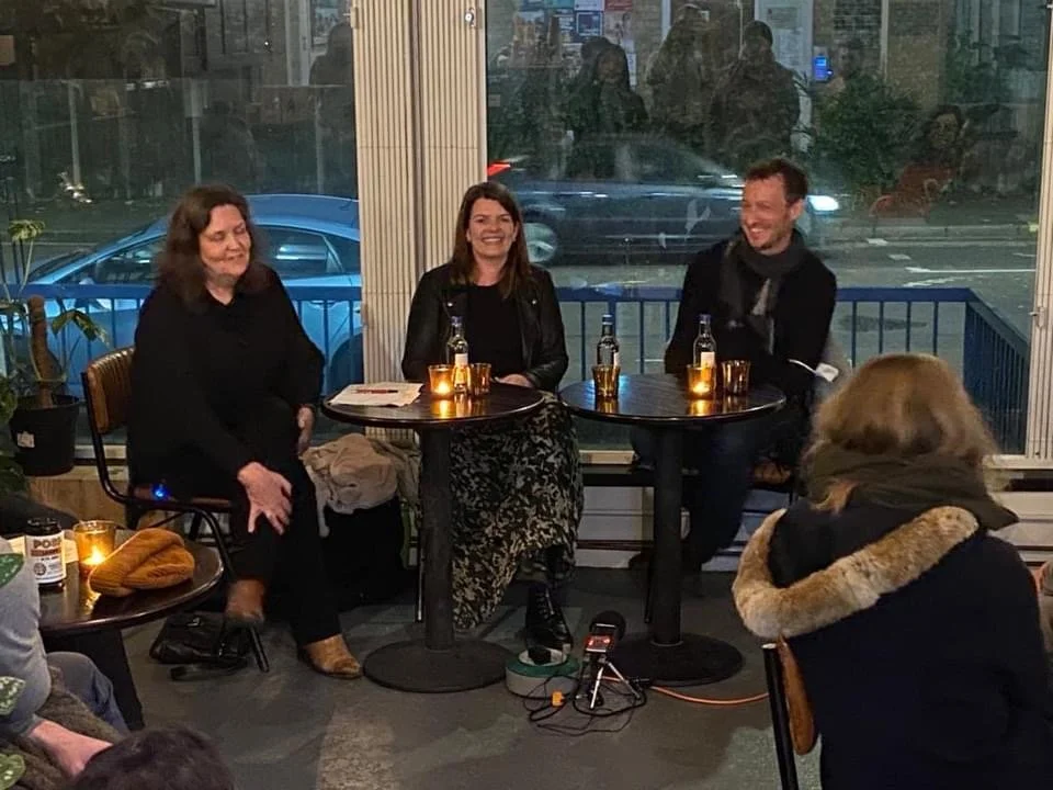 7 Image_Three people sit at tables.JPG
