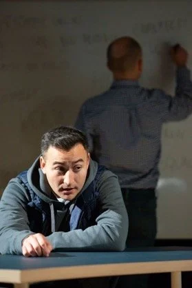 6 Image_Boy leans on desk.JPG