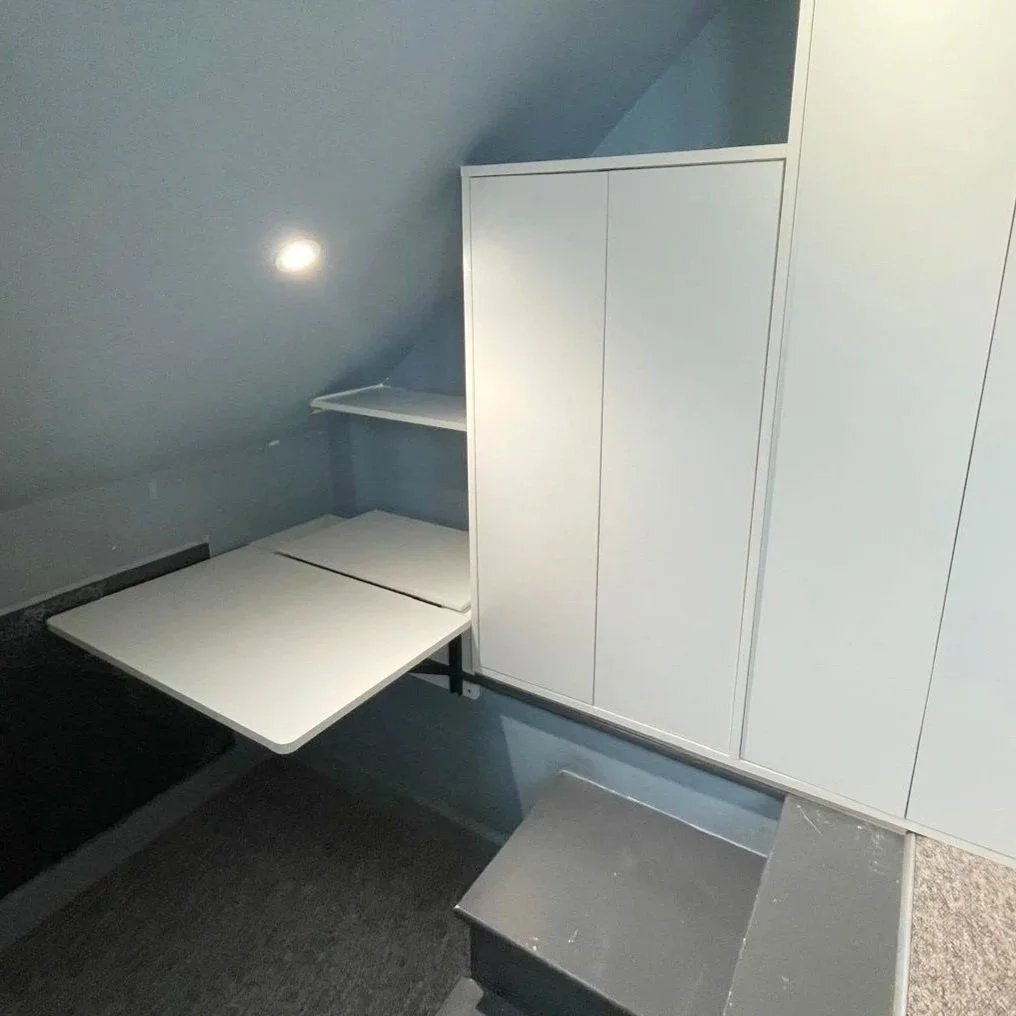 Fitted Furniture:
Fold away desk unit and rear storage box