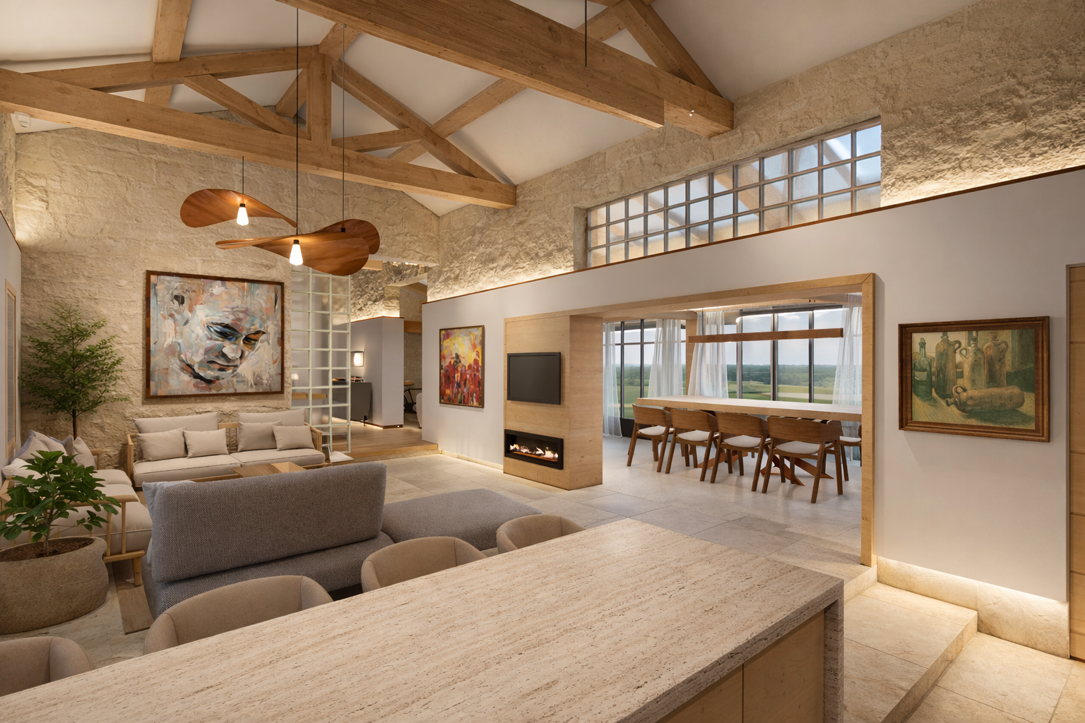 Salon ouvert avec cheminée, peinture moderne de visage, mur en pierre, mobilier en bois clair, grande fenestration avec vue sur la campagne, décor épuré et chaleureux.