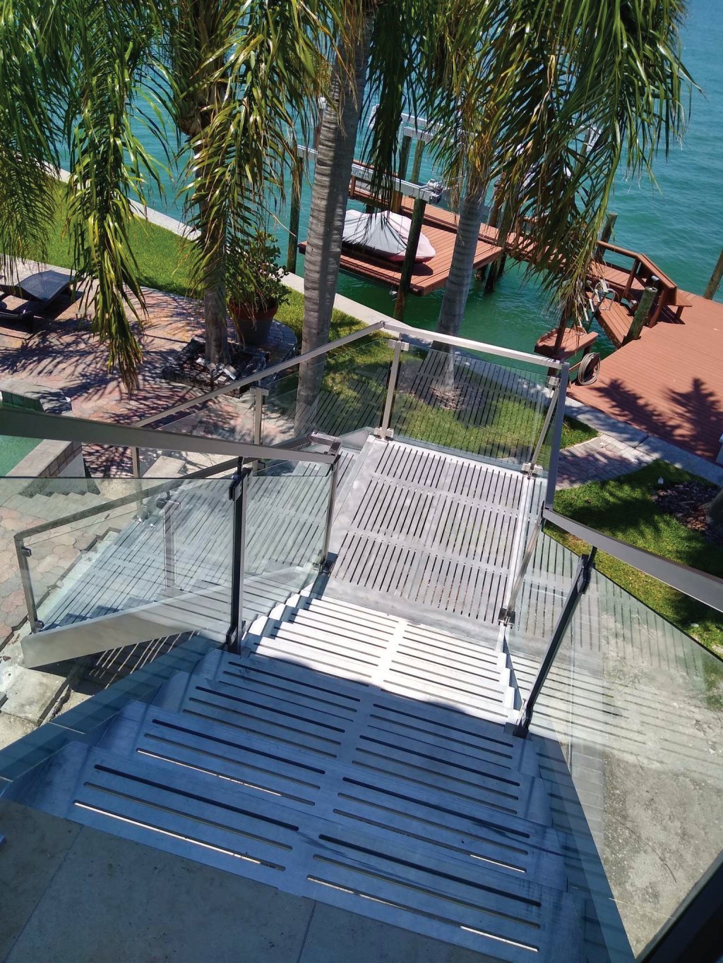 Metal stairs with glass railing