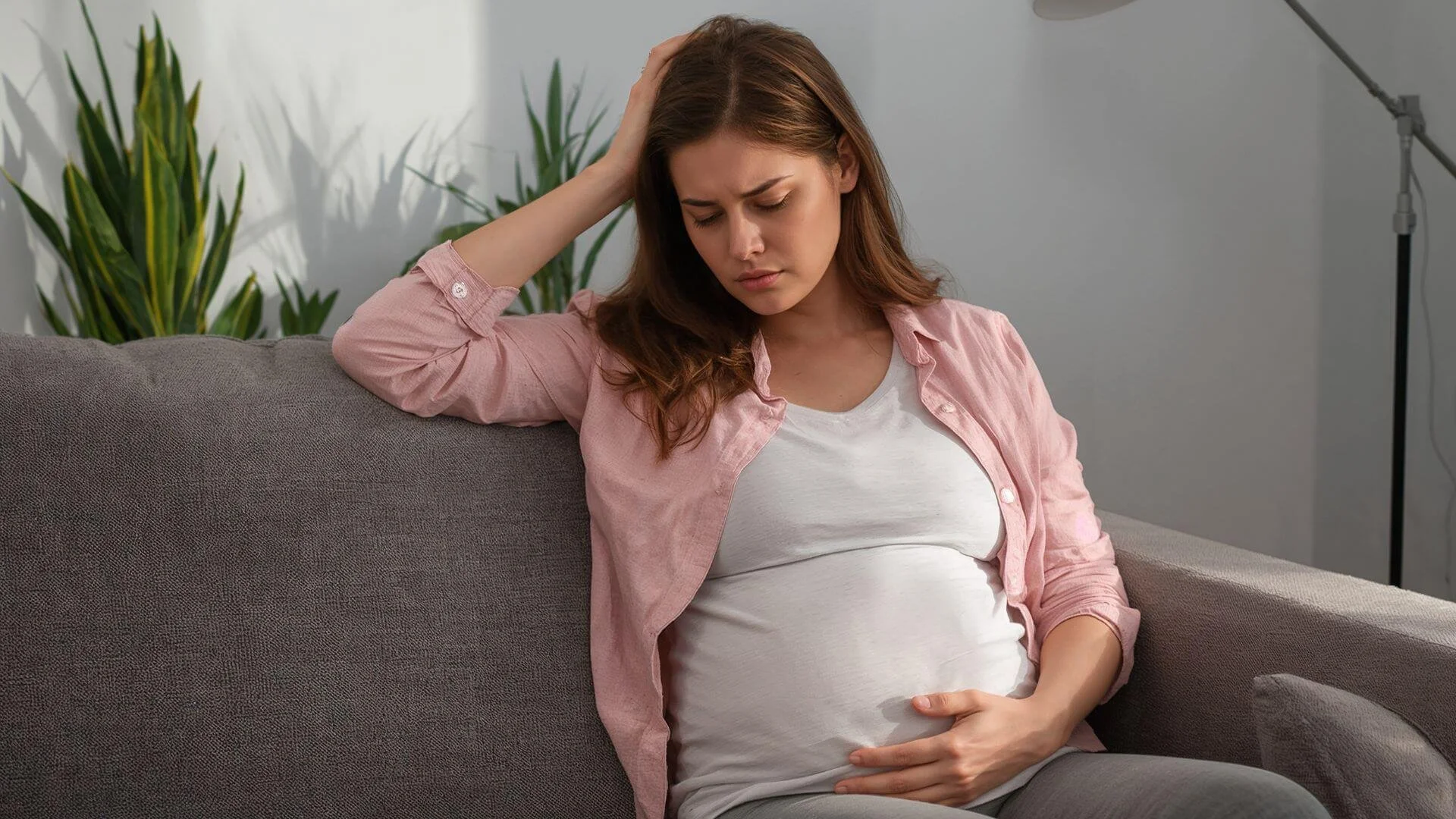 woman holding her upset stomach