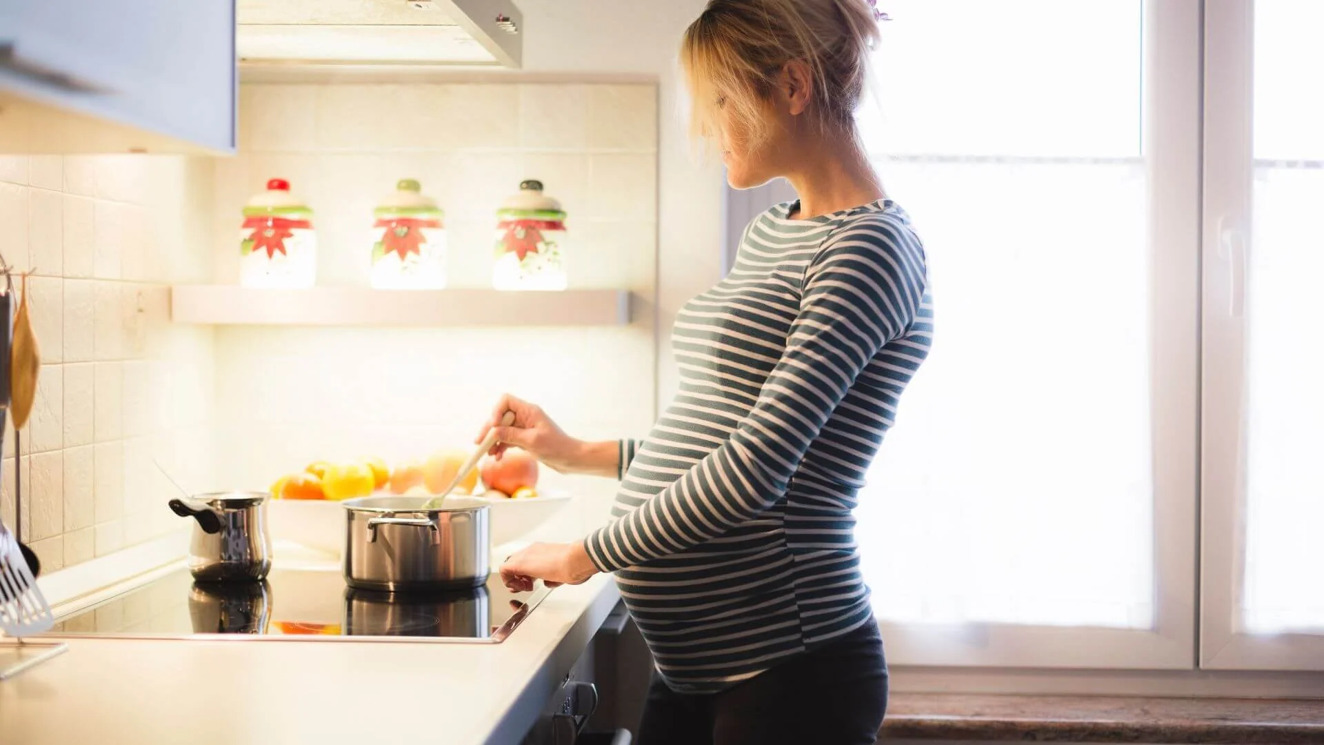 pregnant female prepping healthy meals