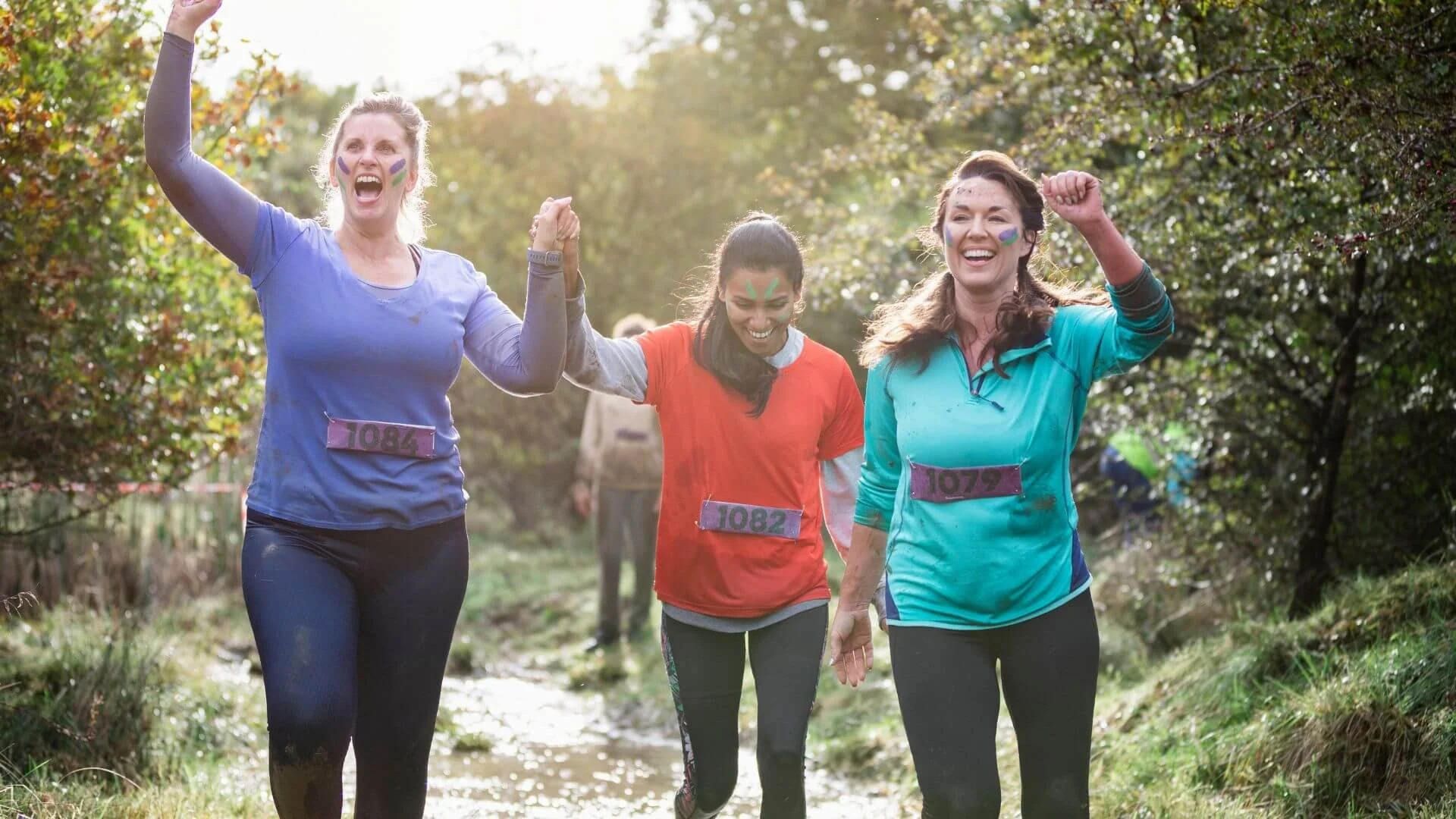 women happily running together