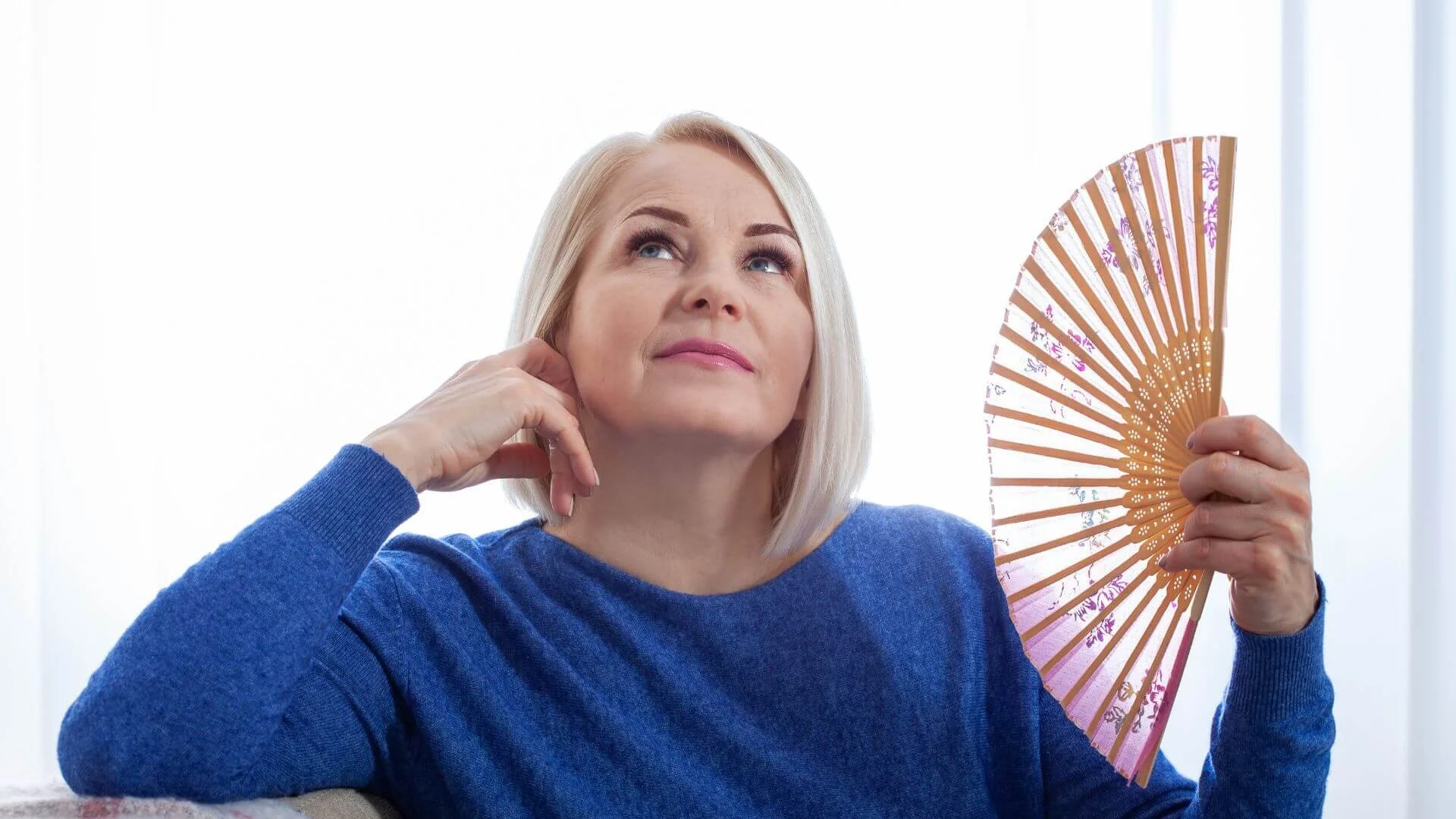 woman fanning herself