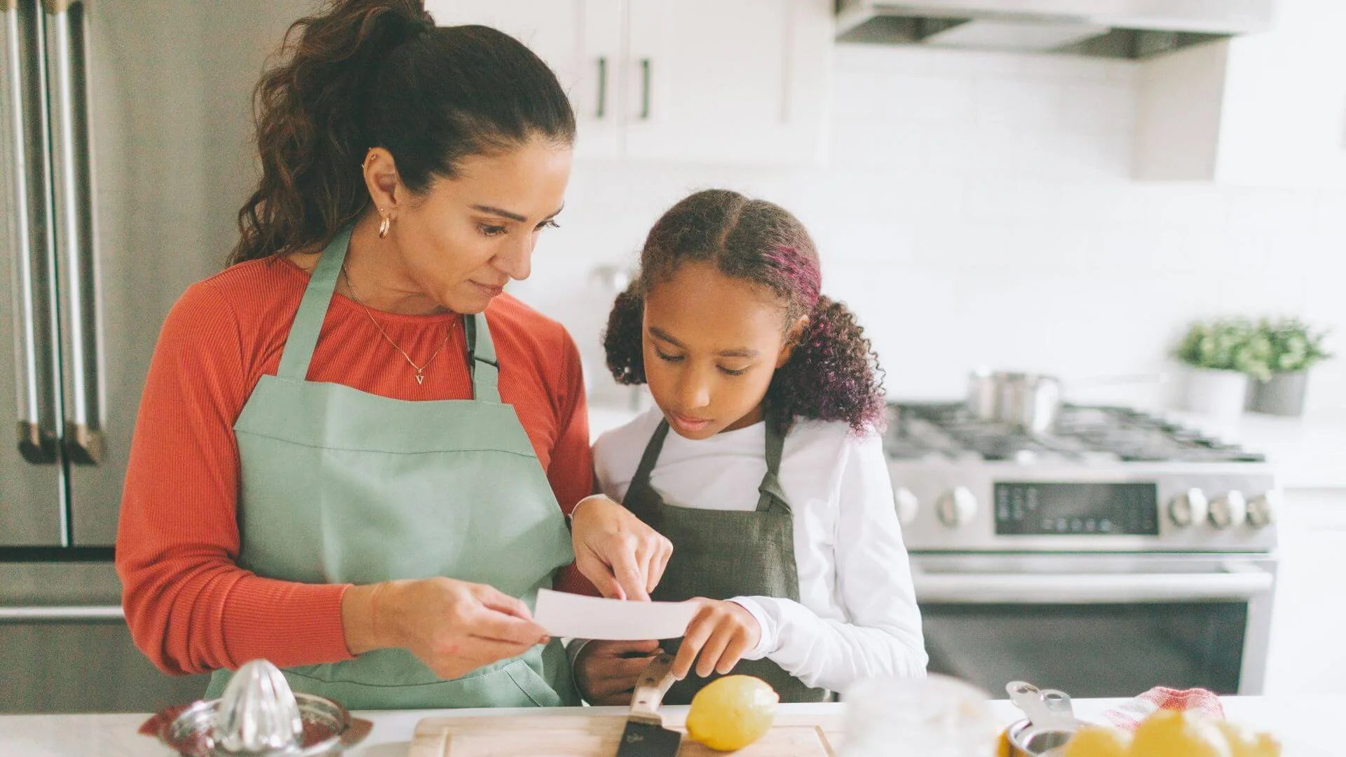 mother and daughter working together to cook a healthy meal