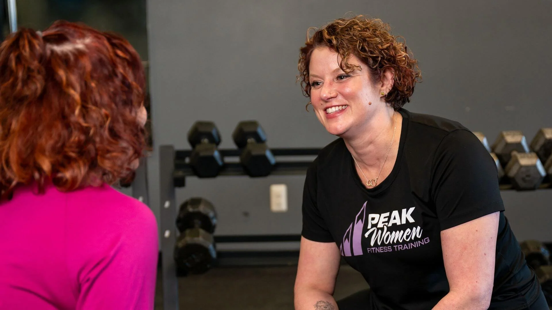 Lissa, Co-Owner of Peak Women smiling and talking