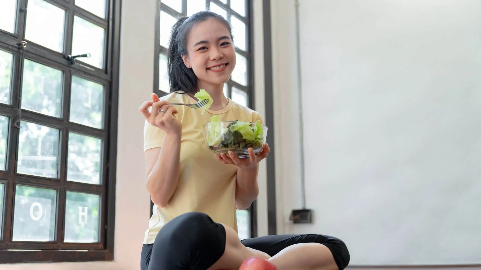 woman happily eating healthily
