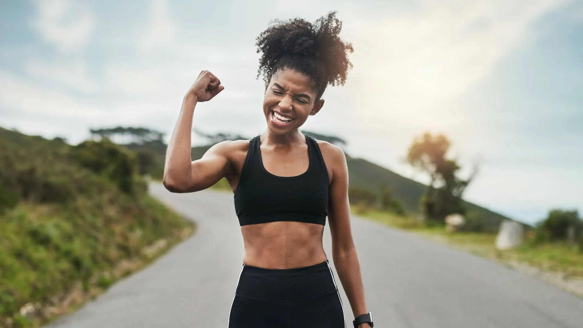 woman celebrating being healthy with nutrition while exercising