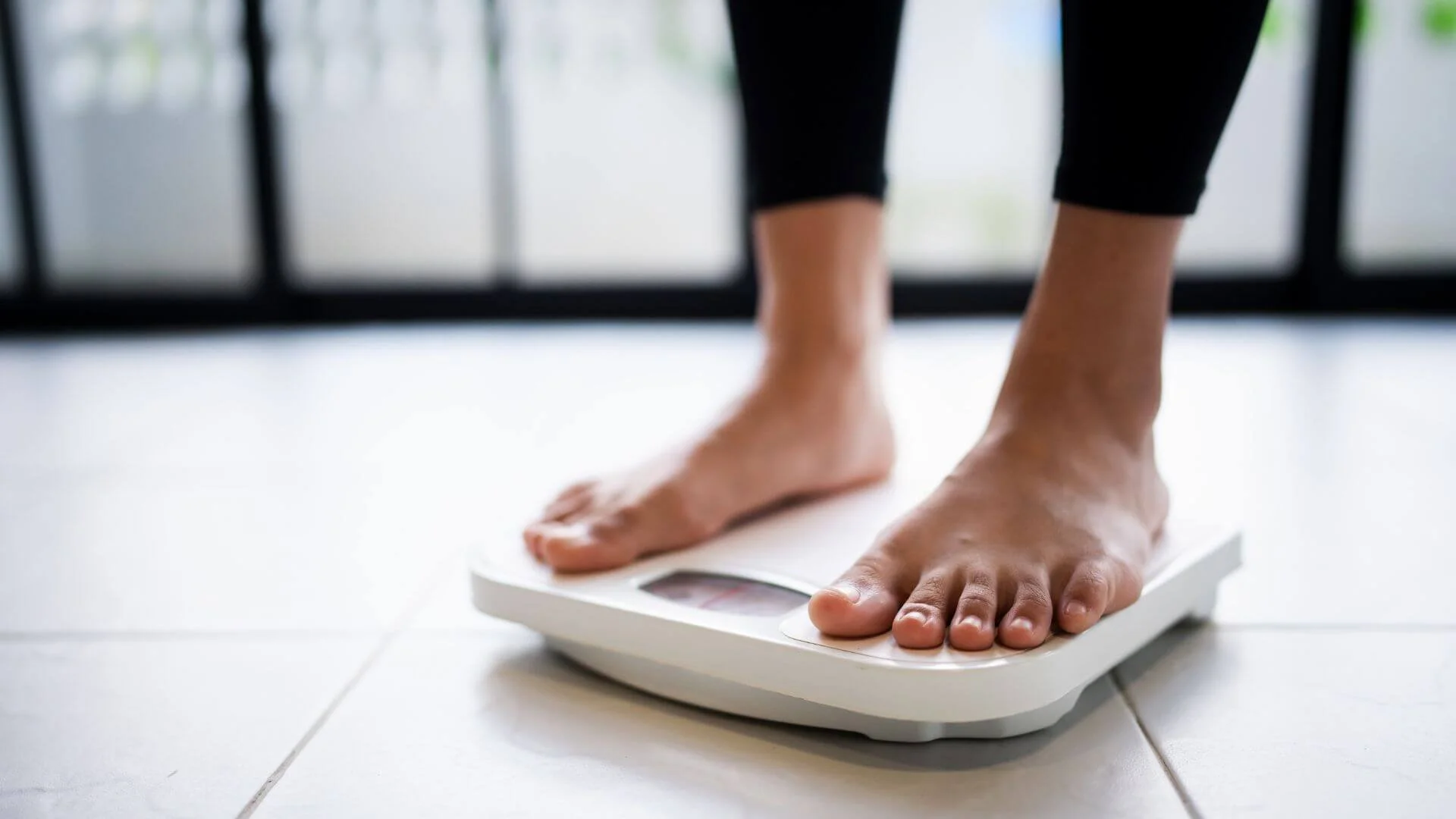 woman standing on a scale