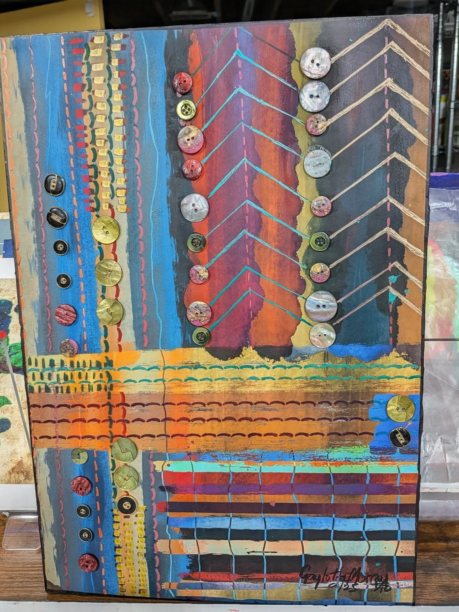 Before becoming an artist, I would spend my time buying sewing patterns and making my own clothes. Over the years I amassed a lot of fabric, patterns, notions and buttons. I no longer sew, but just can't part with what I have. 

As an artist I love c