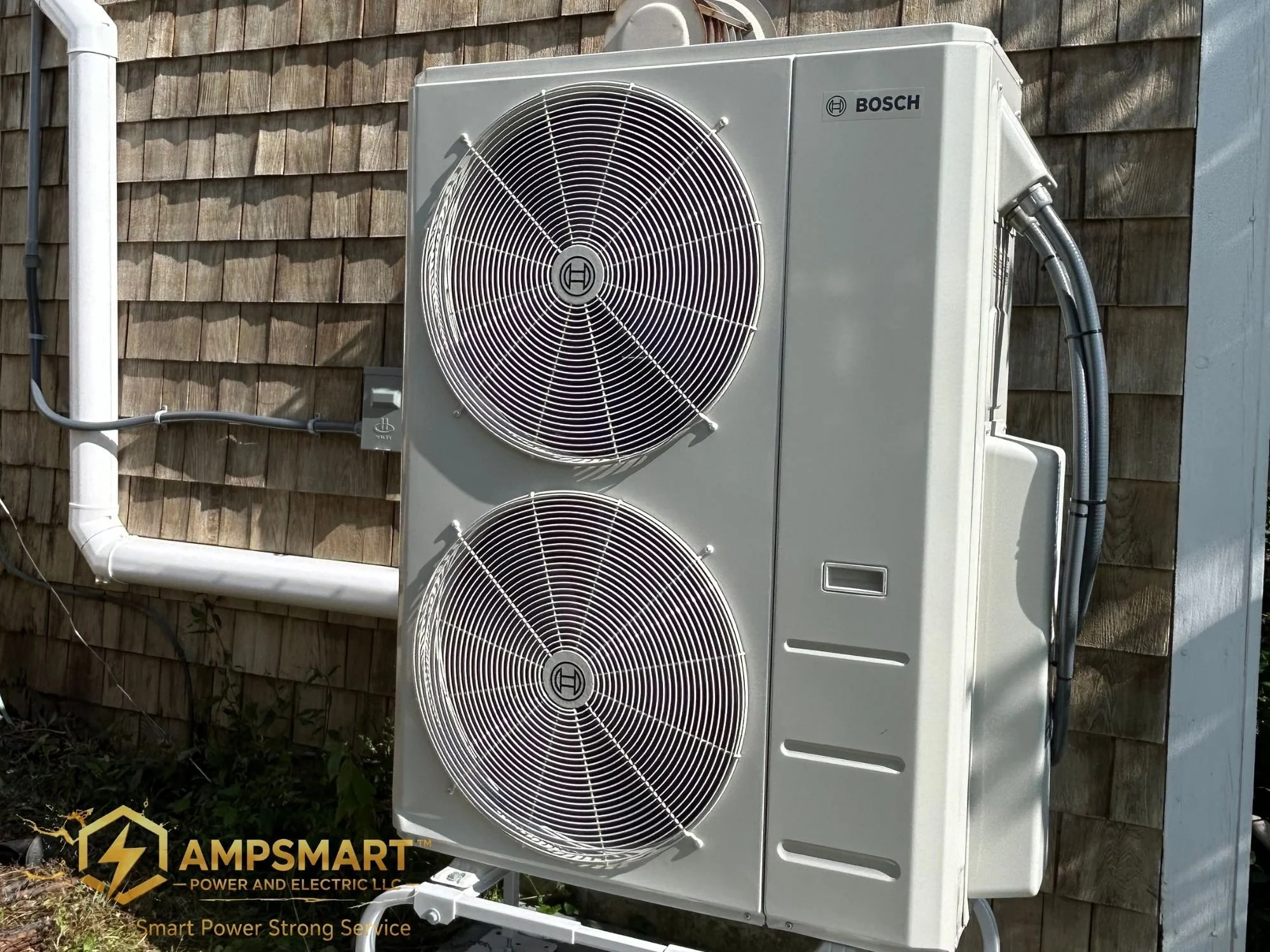 An outdoor air conditioning unit installed on a wooden wall, with pipes connected to it.