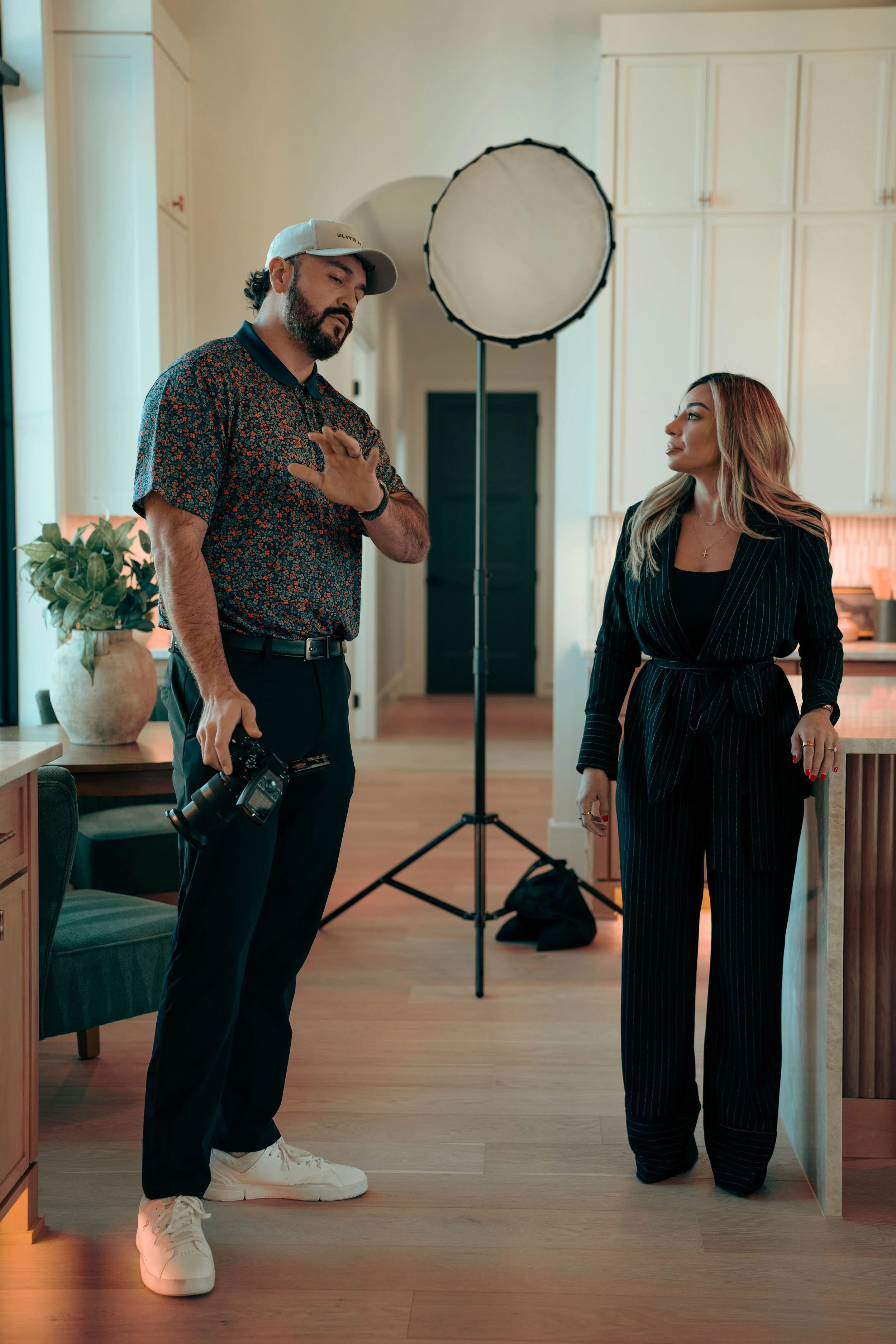 Founder of Elite media discussing photography with client