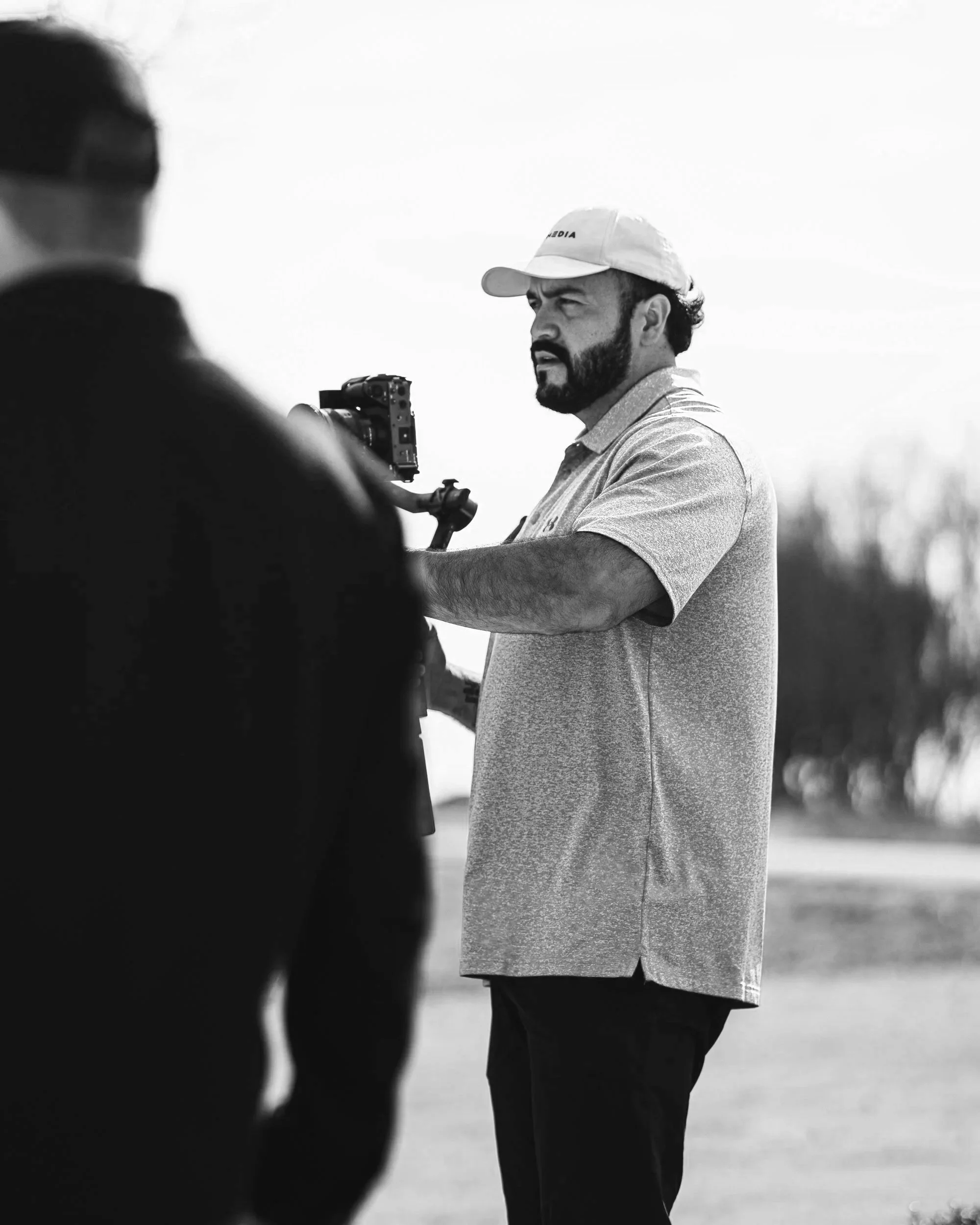 Founder of Elite media directing staff on how to capture specific footage on set.