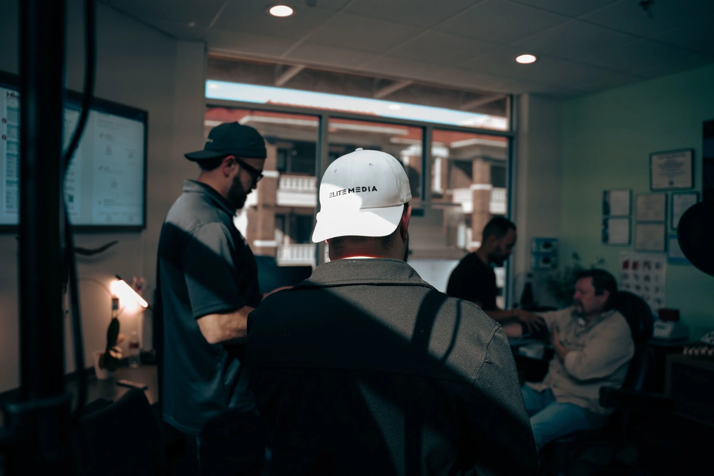 staff of Elite media capturing footage of client leading one of their businesses