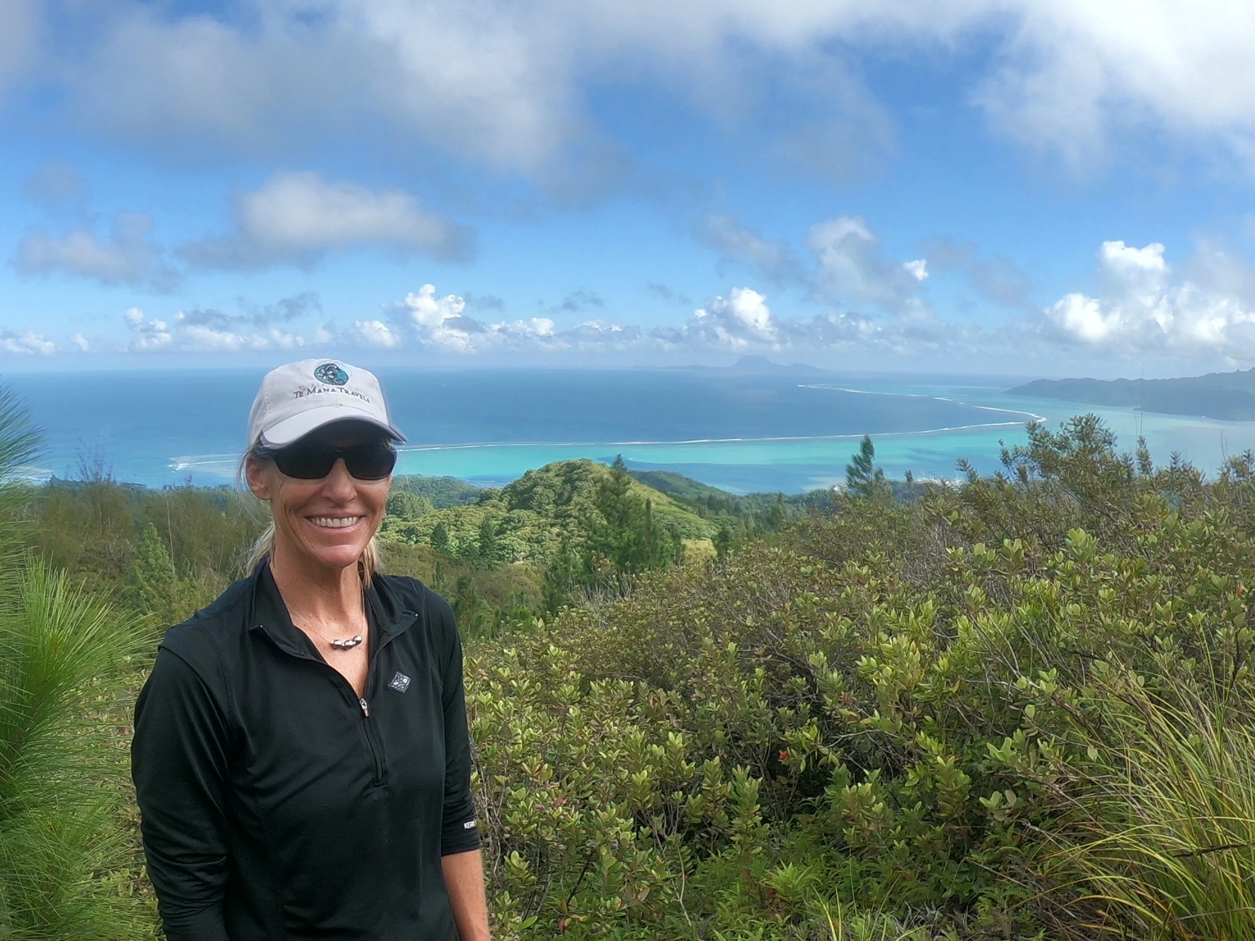 Hiking Mt. Temahani on the island of Raiatea. Stopping for a breather and to take in the view!