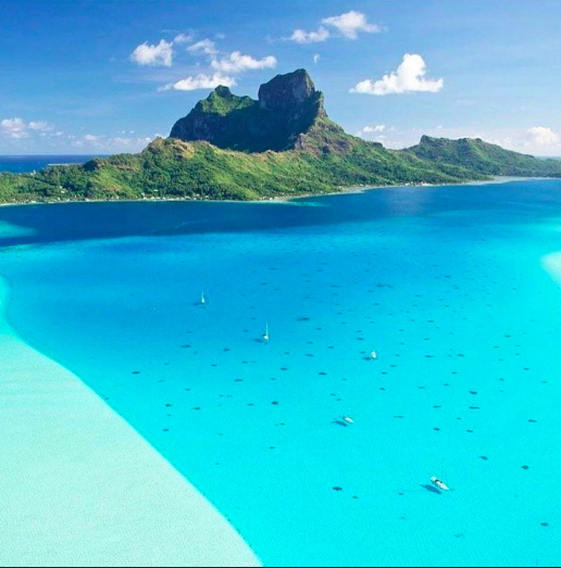 An aerial photo of Bora Bora and the charter catamarans in the harbor