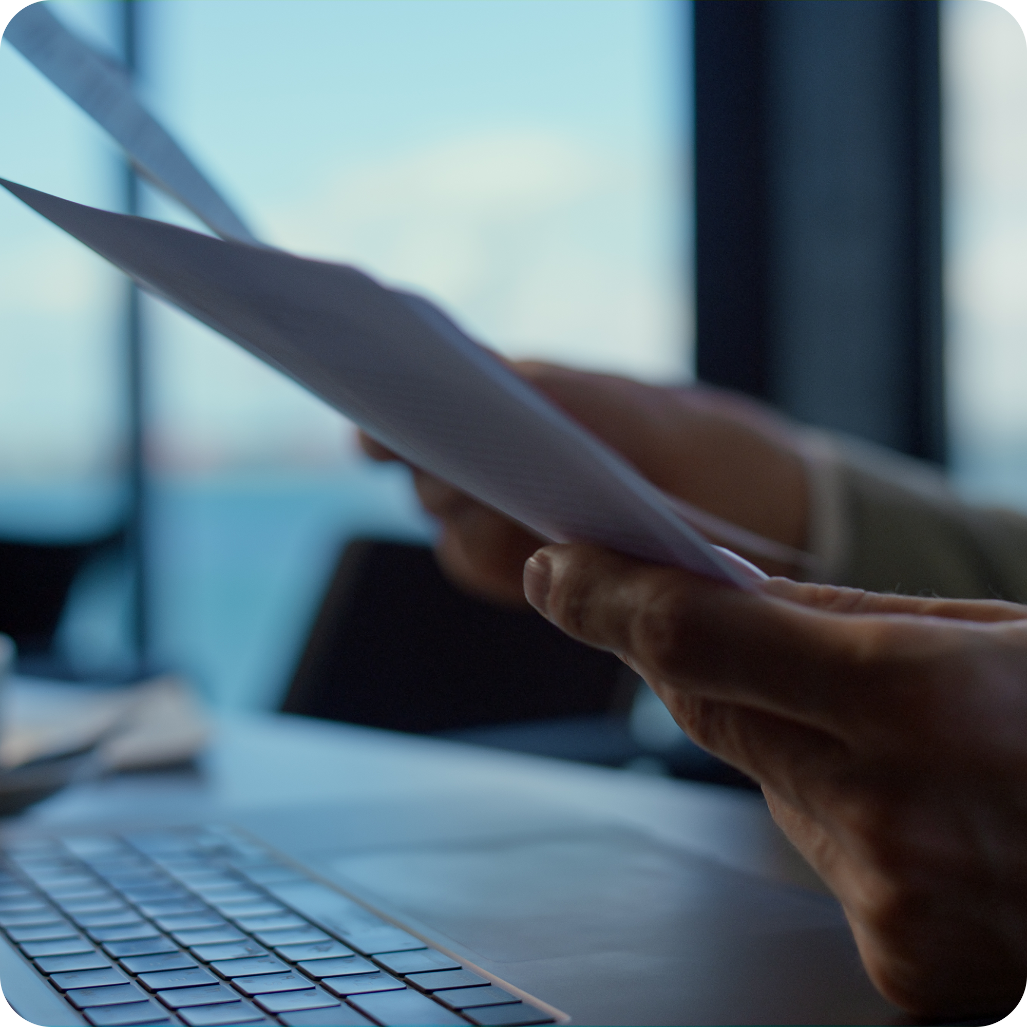 Close-up of a drone academy student reviewing training materials beside a laptop – theoretical preparation for A2 and STS drone pilot certification exam in a professional aviation learning environment.