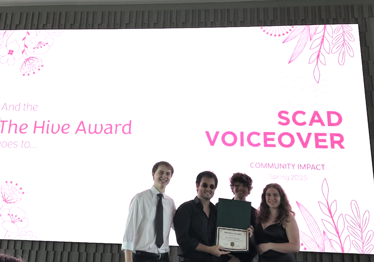 SCAD Voiceover Club - receiving an award for community impact from innovative programming designed by Thiago Oppermann