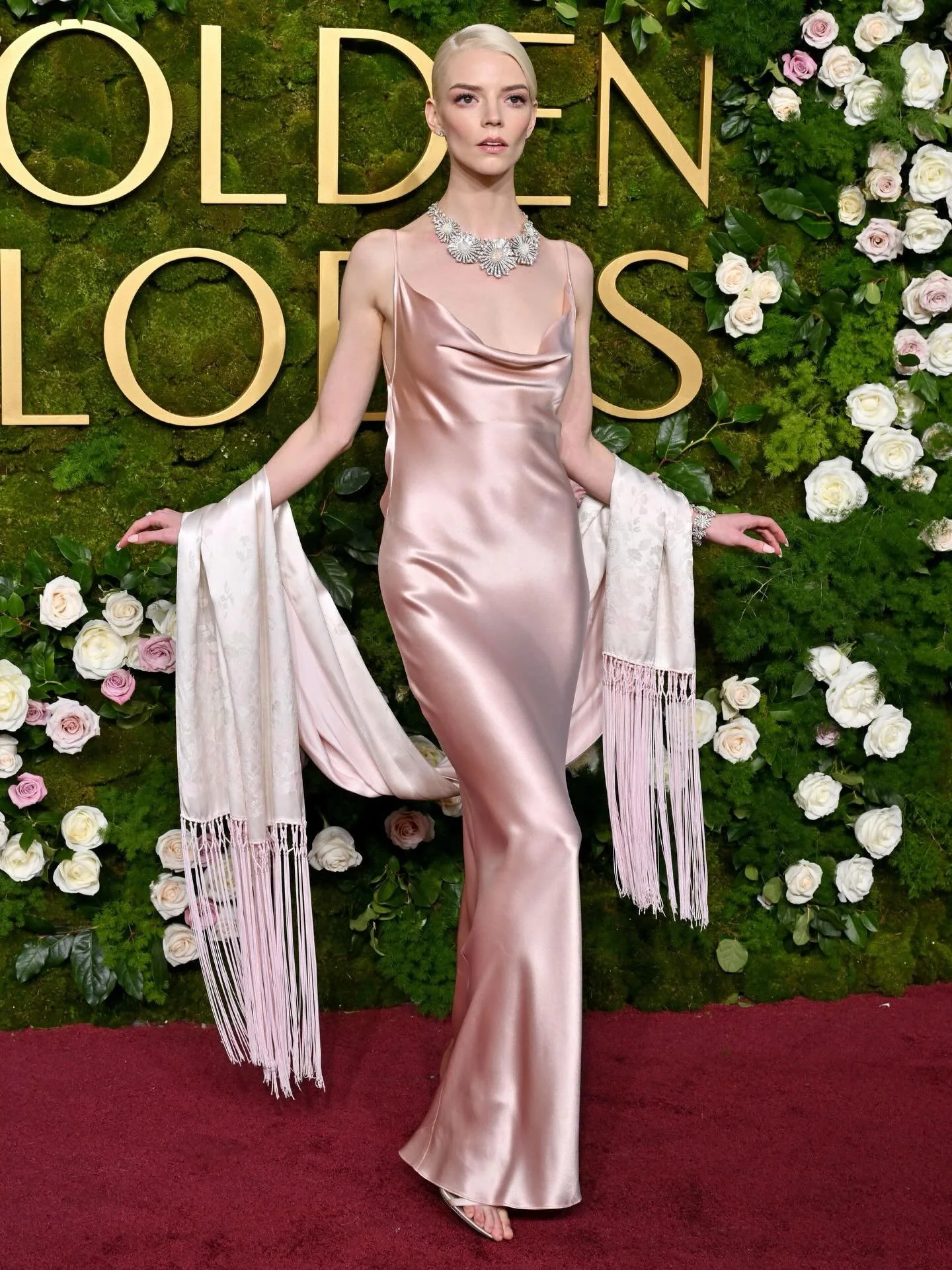 The next lady from our archive is Anya Taylor-Joy. She purchased this beautiful 1998 John Galliano for Christian Dior bias-cut blush satin backless gown with matching fringed shawl from us, to wear to the Golden Globes.

The images show her wearing t