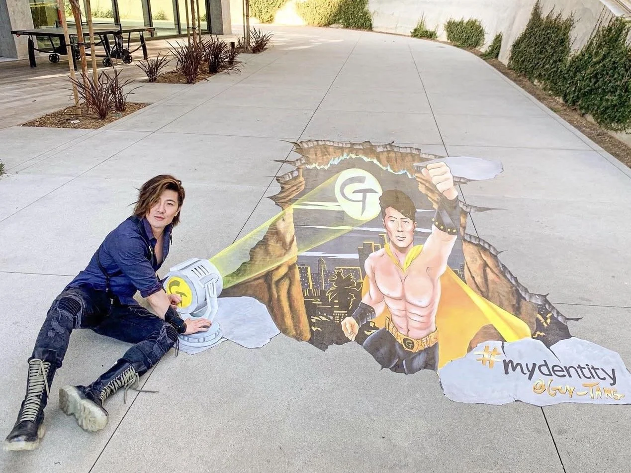 Guy Tang in front of chalk art activation outside Premiere Trade Show