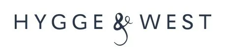 Hygee & West logo with text in black capital letters and a decorative ampersand