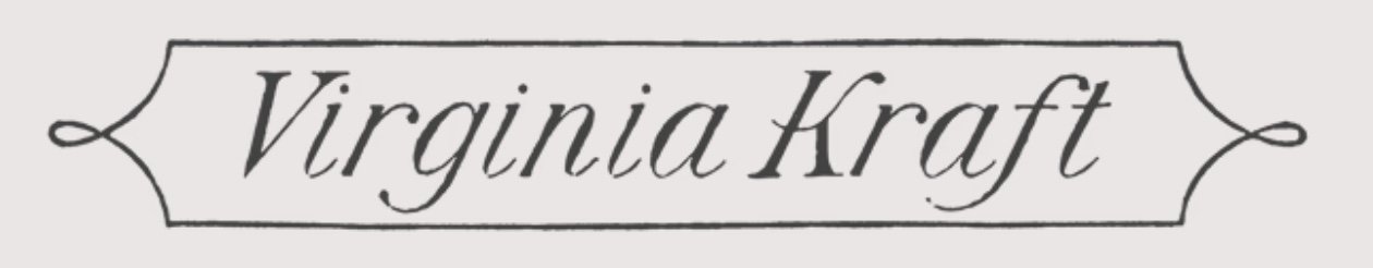 Close-up of a logo with the text 'Virginia Kraft' in elegant cursive script, enclosed in a decorative black line border.