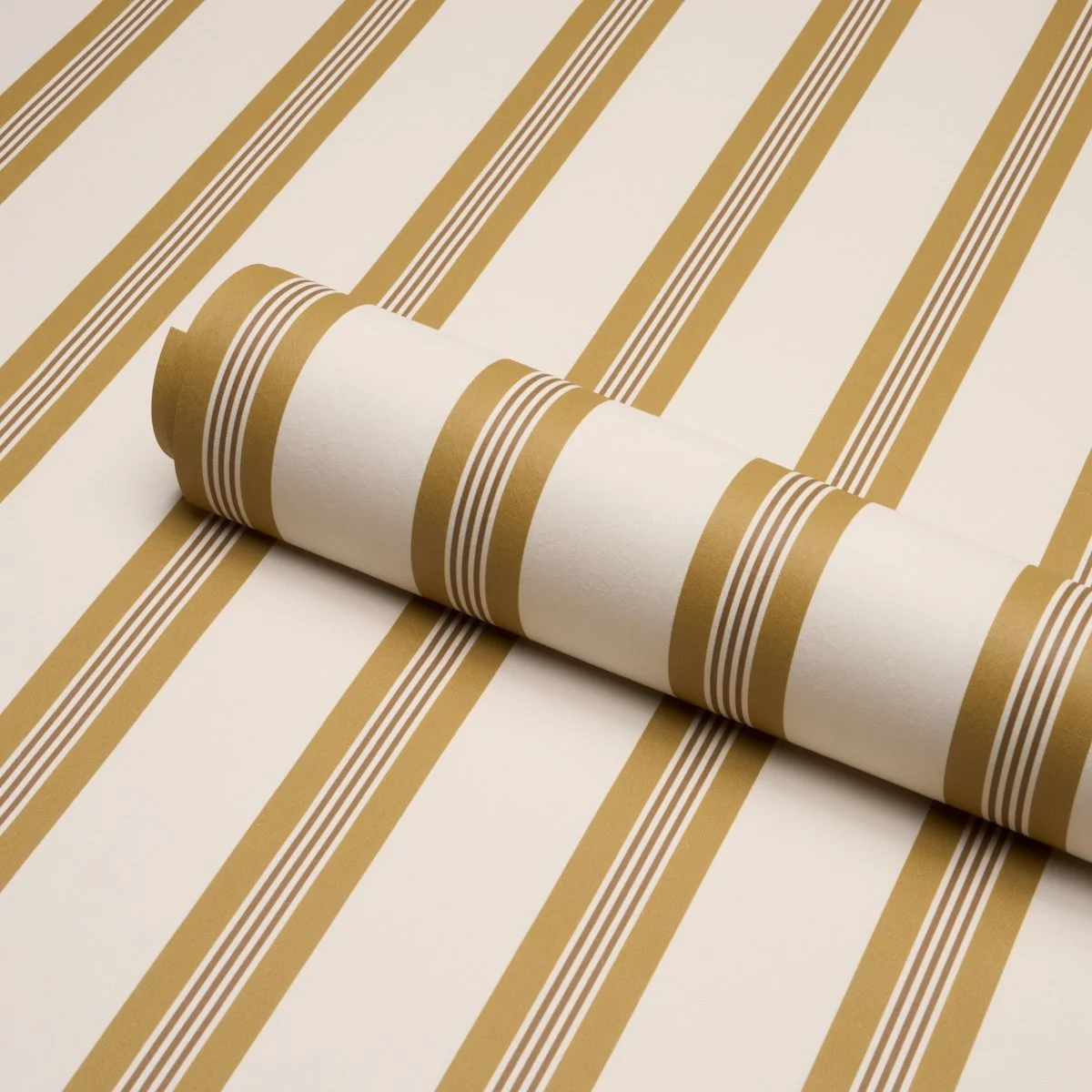 Schumacher Chatham Stripe wallpaper roll in Ochre, cream and gold multi-width stripes