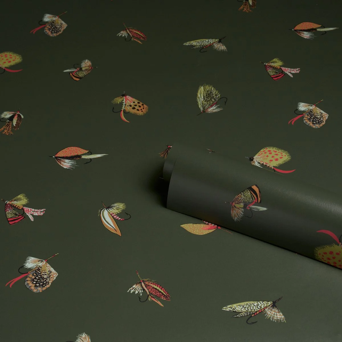 Schumacher Fly Fishing wallpaper roll in Forest Green, feather flies on a deep green ground